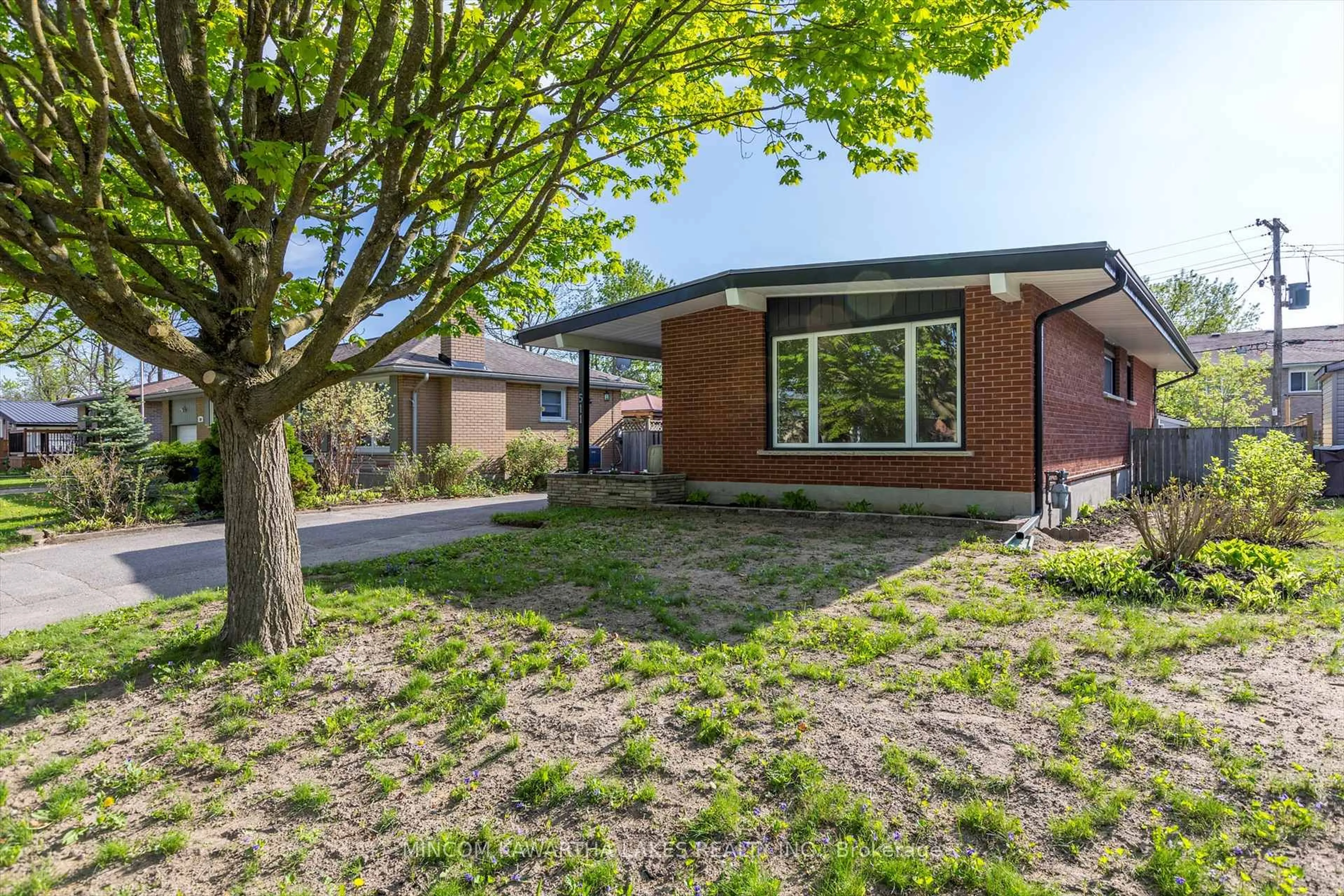 Home with brick exterior material, street for 511 Robert Rd, Peterborough South Ontario K9J 5S9