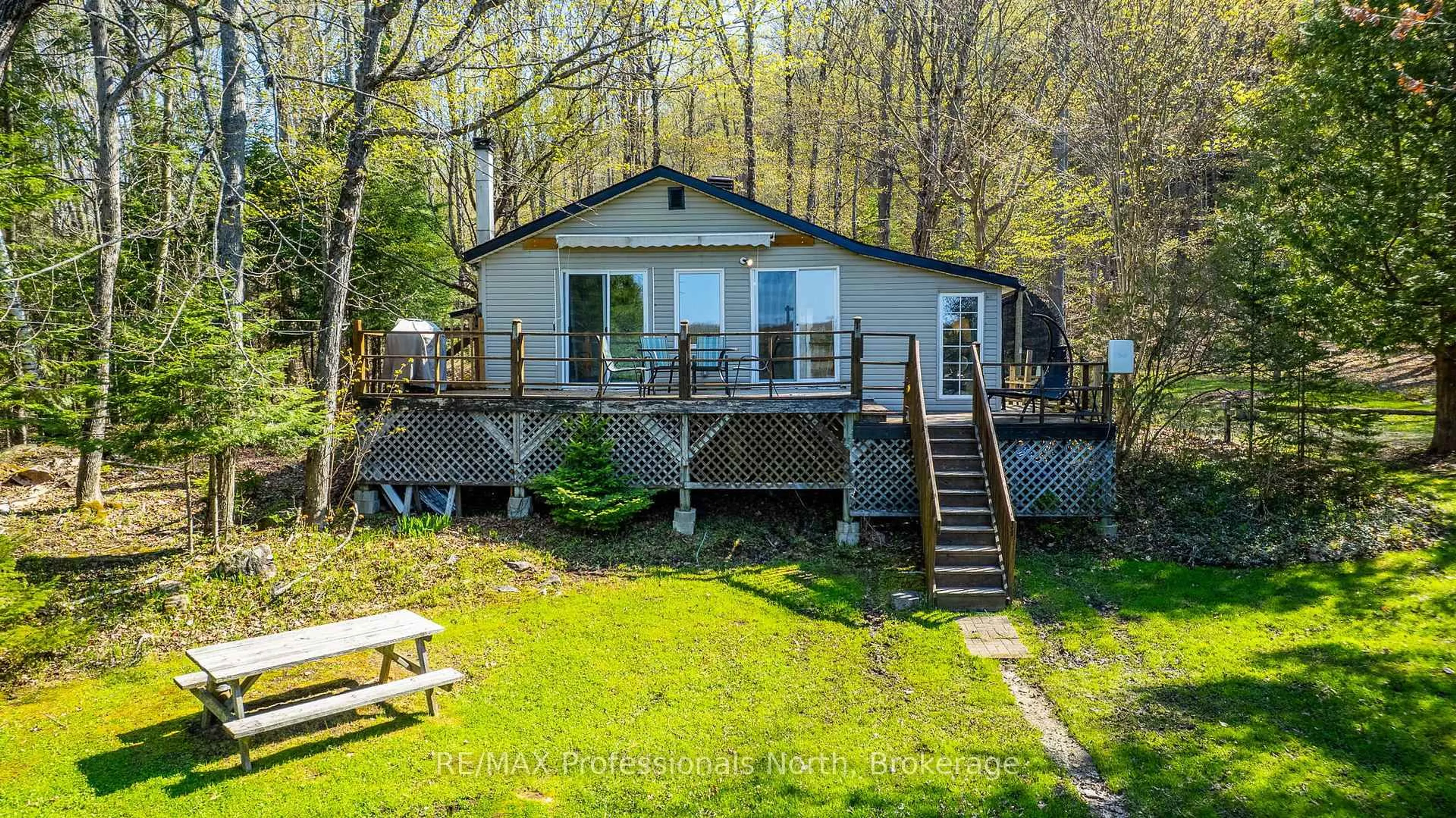 A pic from outside/outdoor area/front of a property/back of a property/a pic from drone, water/lake/river/ocean view for 1179 Sharon Lake Dr, Minden Hills Ontario K0M 2K0
