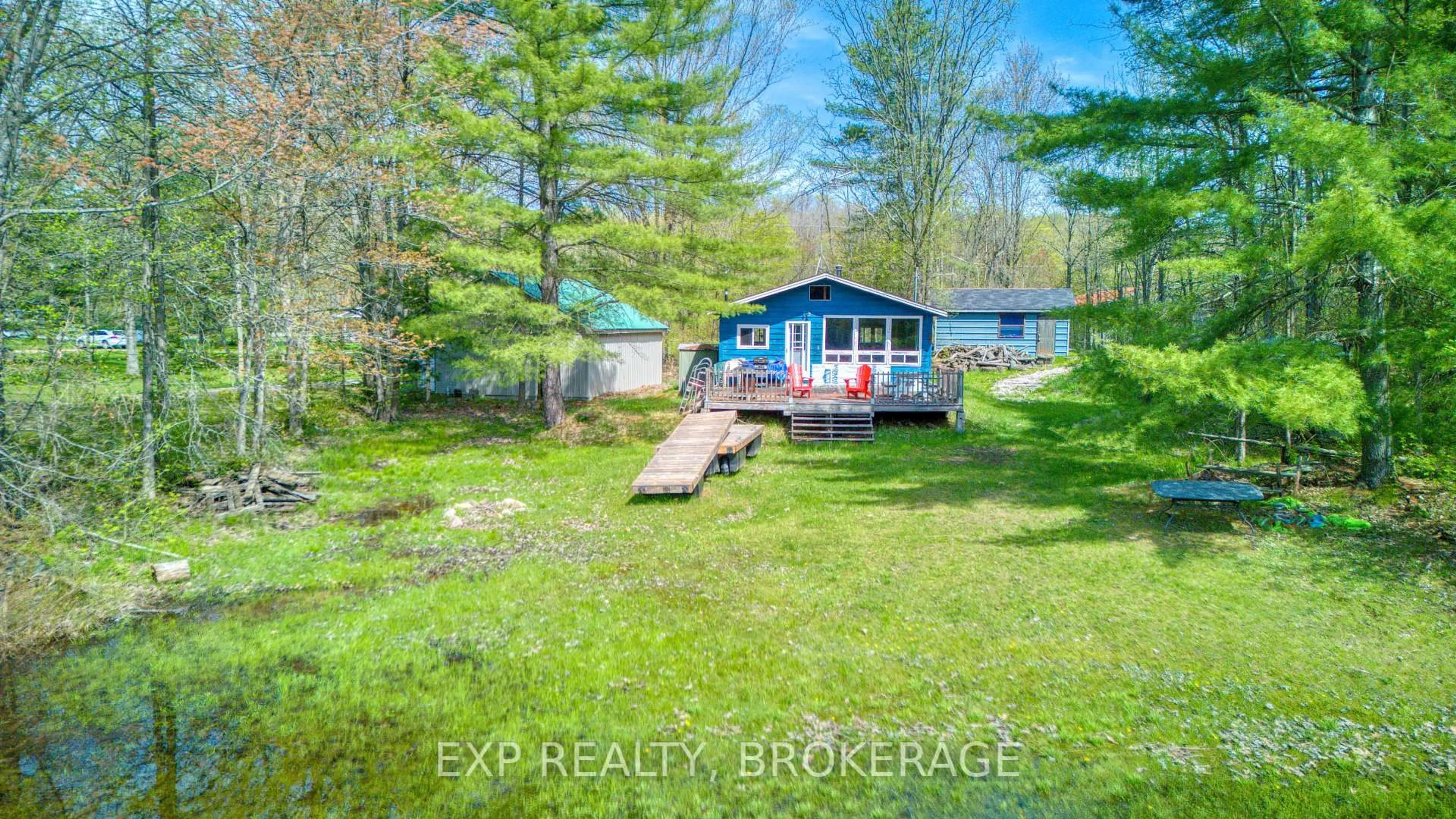 A pic from outside/outdoor area/front of a property/back of a property/a pic from drone, water/lake/river/ocean view for 1036 Turner Way, Arden Ontario K0H 1B0