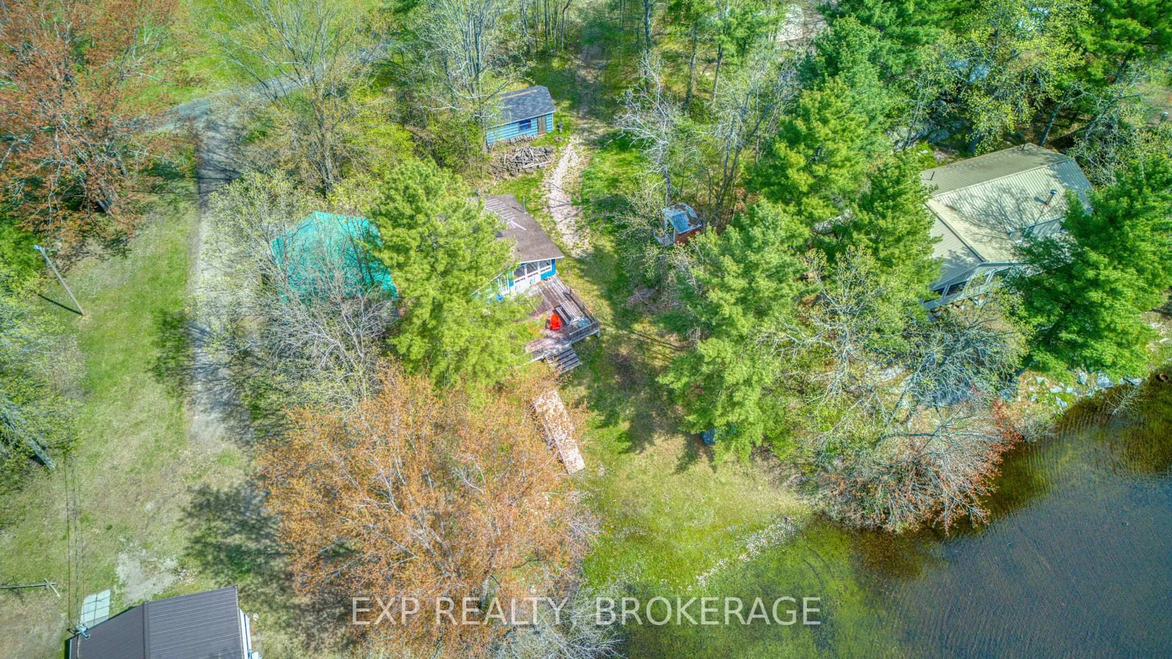 A pic from outside/outdoor area/front of a property/back of a property/a pic from drone, forest/trees view for 1036 Turner Way, Arden Ontario K0H 1B0