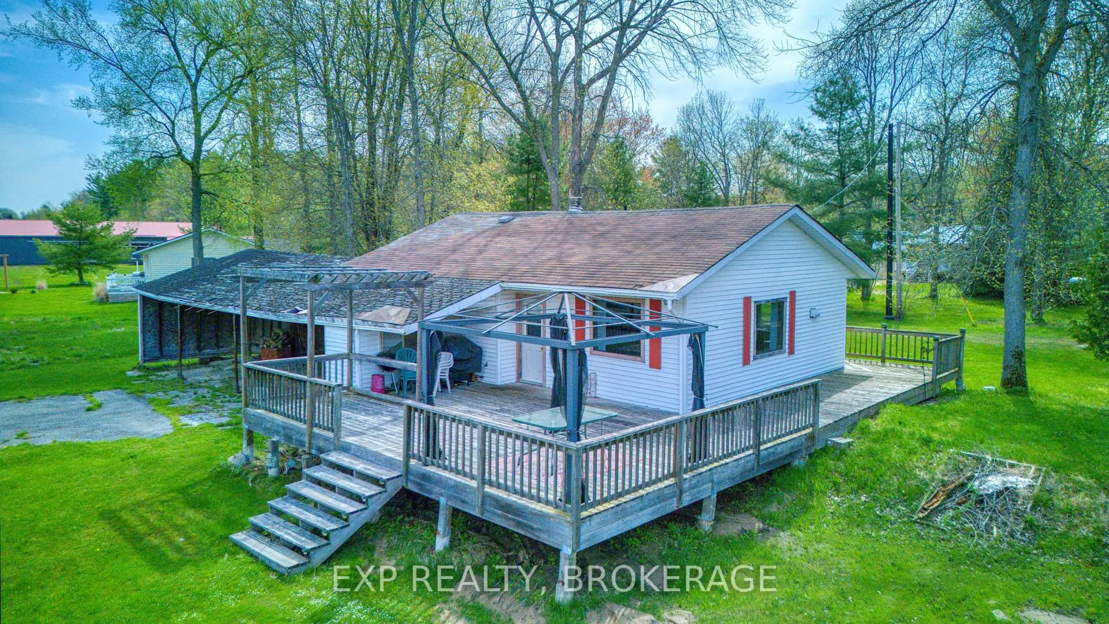 A pic from outside/outdoor area/front of a property/back of a property/a pic from drone, water/lake/river/ocean view for 1013 Turner Way, Arden Ontario K0H 1B0