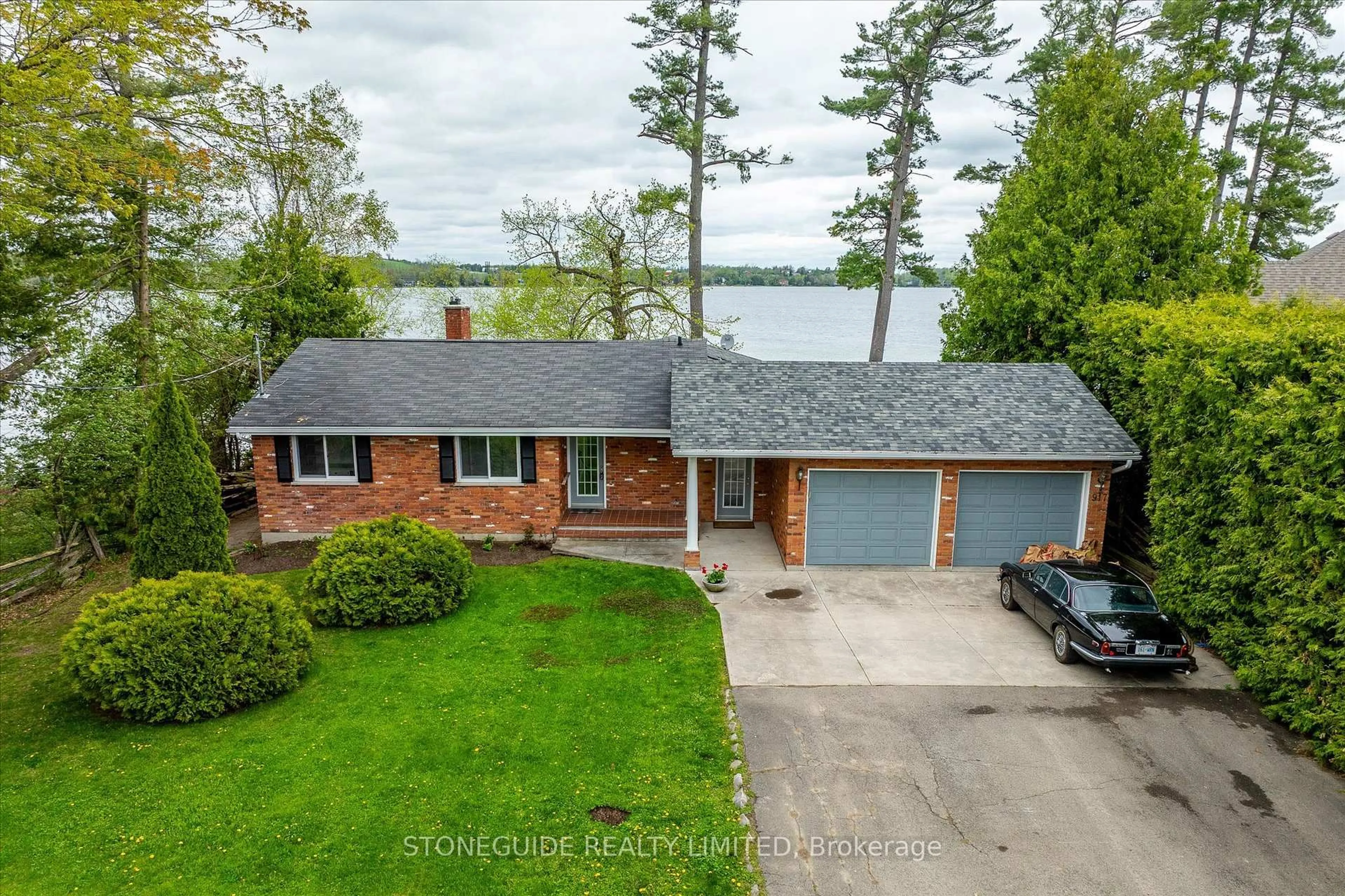 A pic from outside/outdoor area/front of a property/back of a property/a pic from drone, water/lake/river/ocean view for 917 Tindle Crt, Selwyn Ontario K9J 0C5