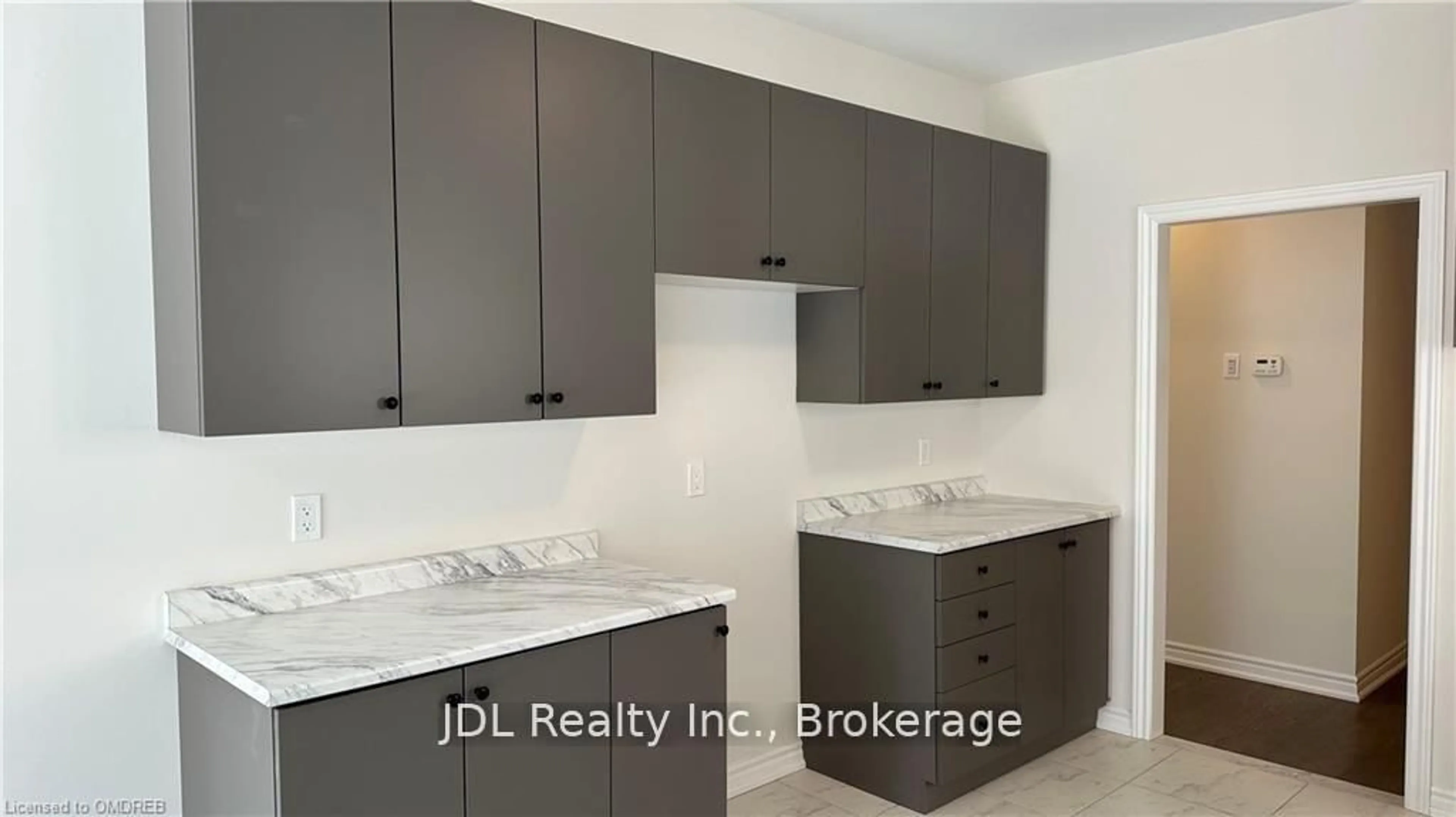 Kitchen with laundary machines, ceramic/tile floor for 231 Palace St, Thorold Ontario L2V 0N2