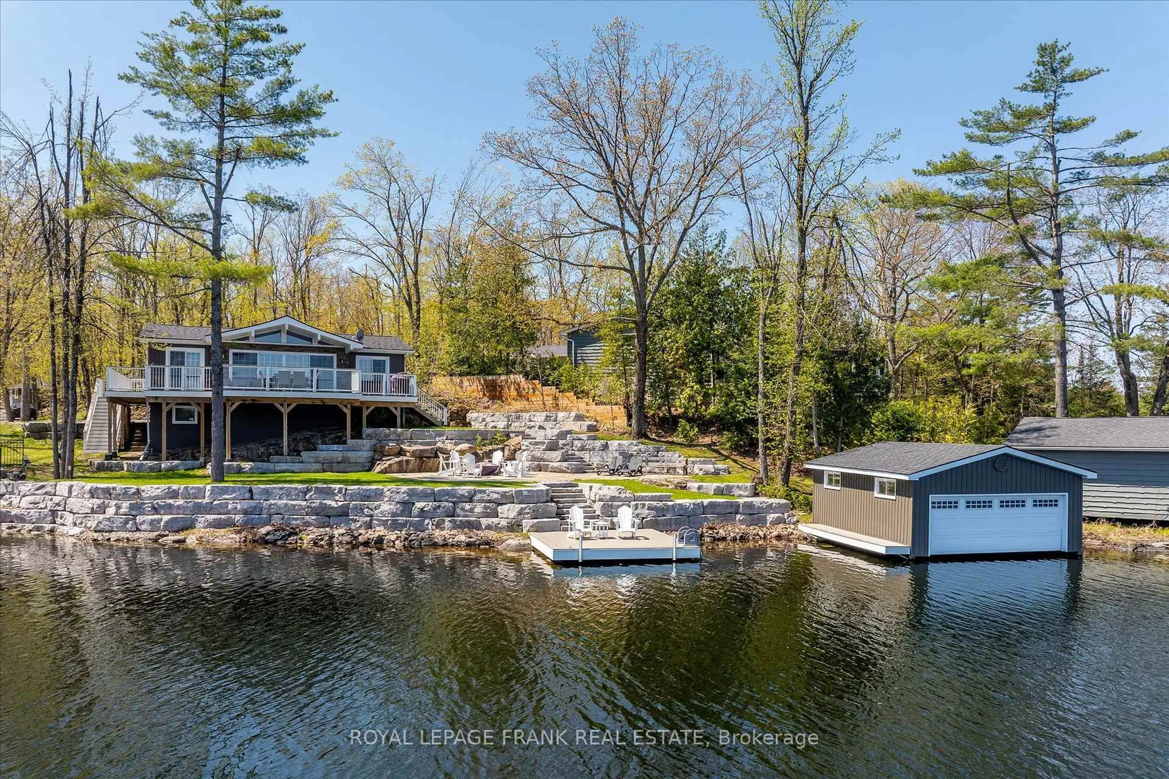 A pic from outside/outdoor area/front of a property/back of a property/a pic from drone, water/lake/river/ocean view for 331 Elbow Point Rd, Trent Lakes Ontario K0L 1J0