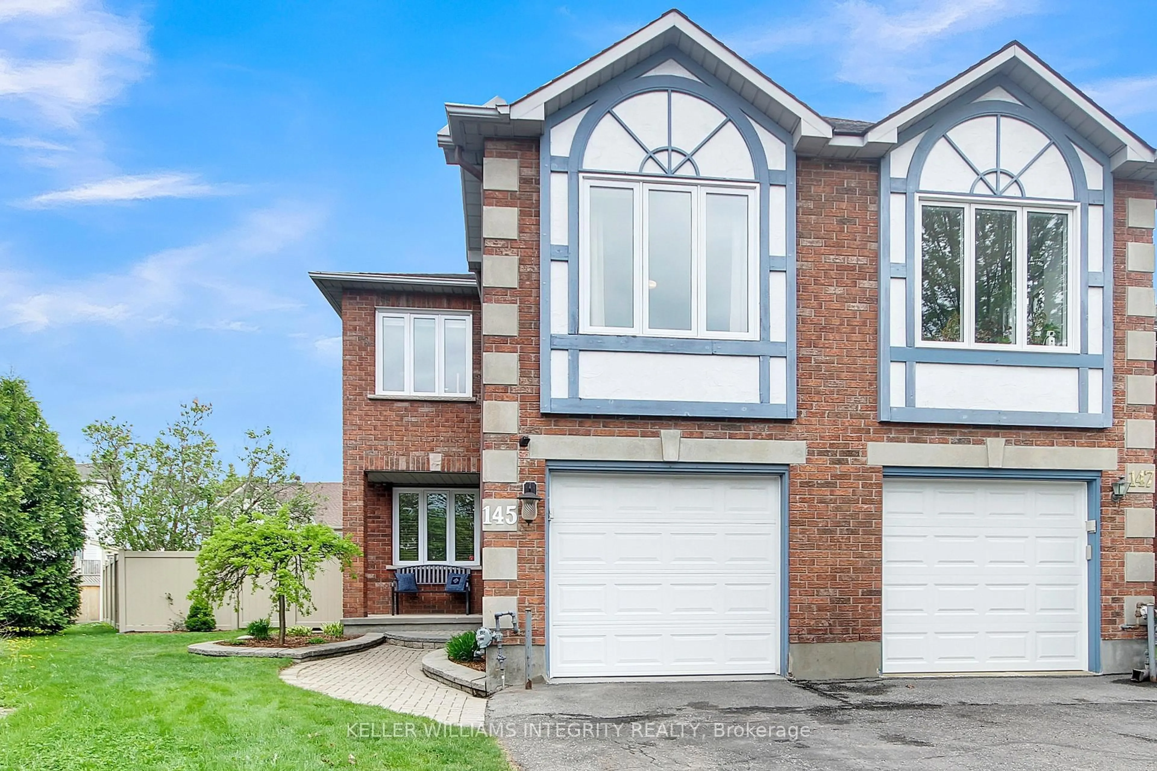 Home with brick exterior material, street for 145 Hunterswood Cres, Ottawa Ontario K1G 5W1