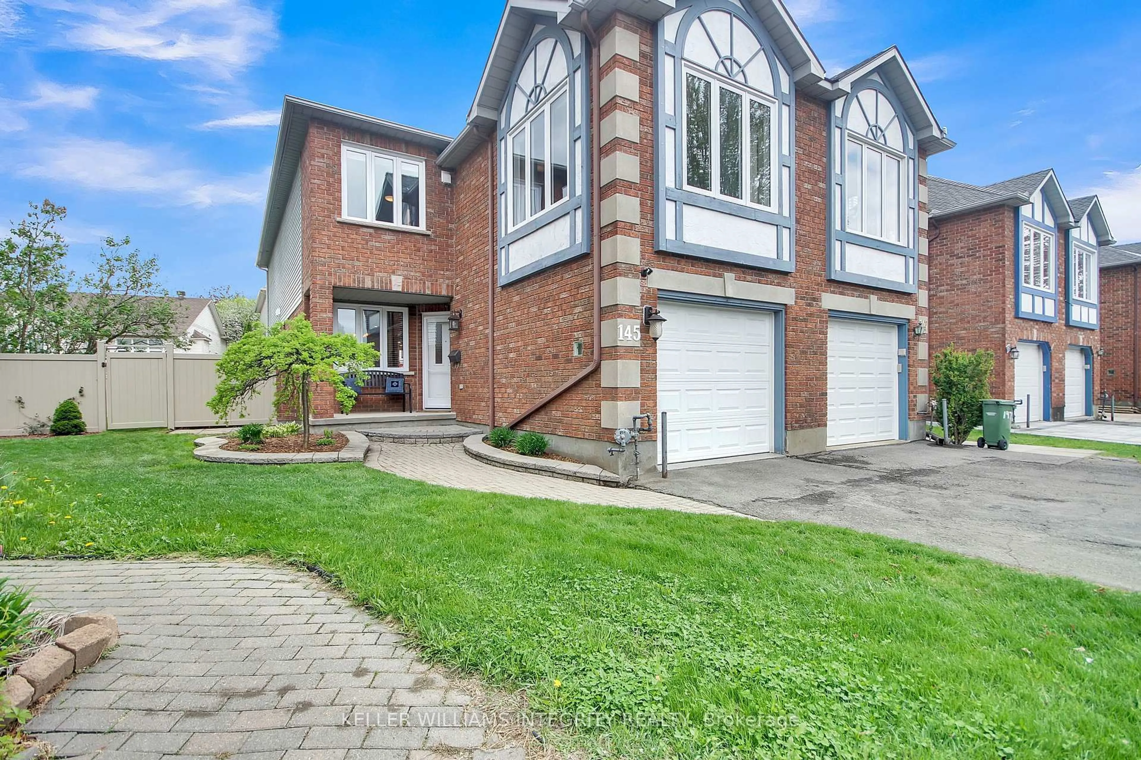 Home with brick exterior material, street for 145 Hunterswood Cres, Ottawa Ontario K1G 5W1