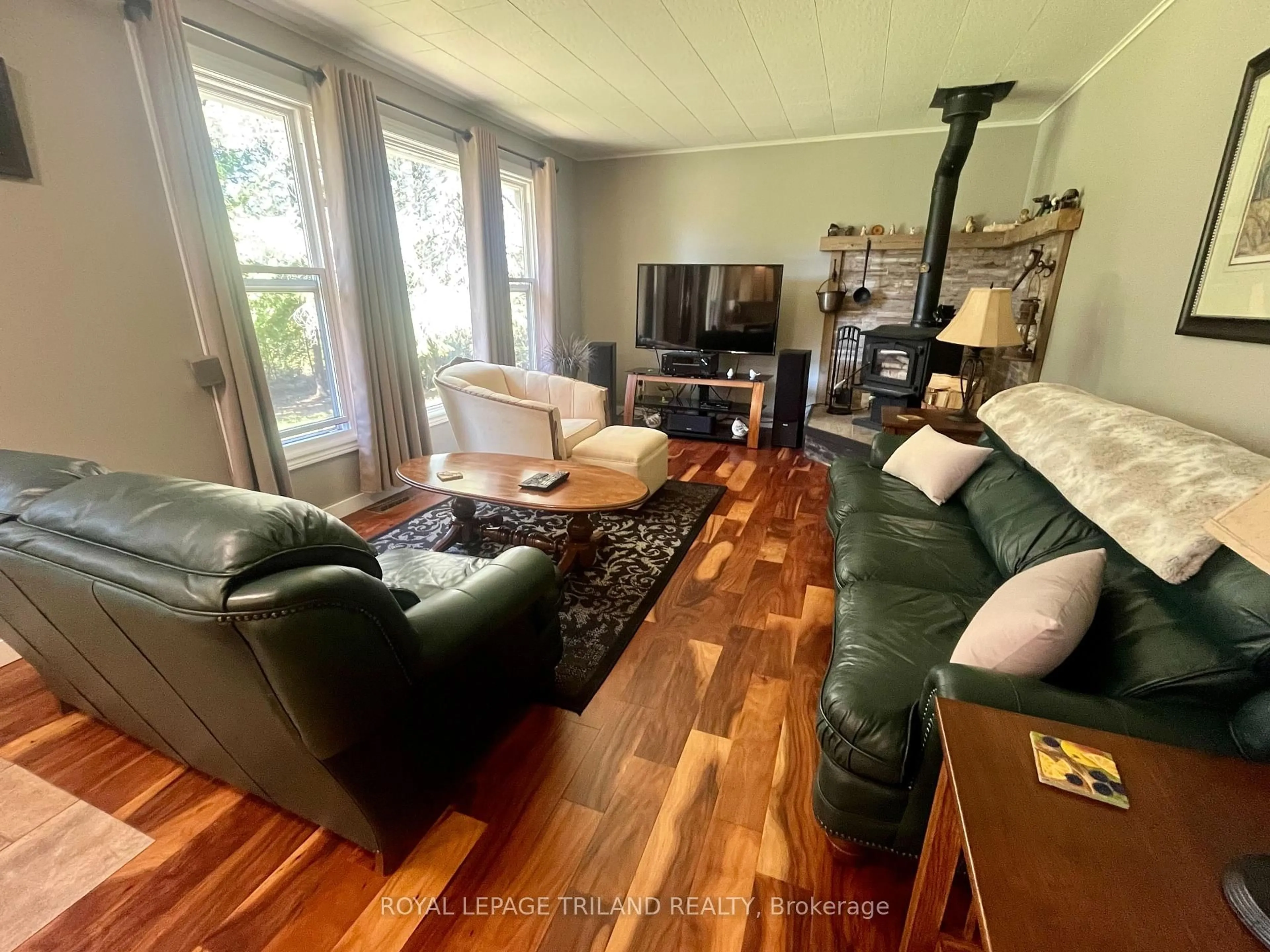 Living room with furniture, wood/laminate floor for 179 Warner Bay Rd, Northern Bruce Peninsula Ontario N0H 2R0