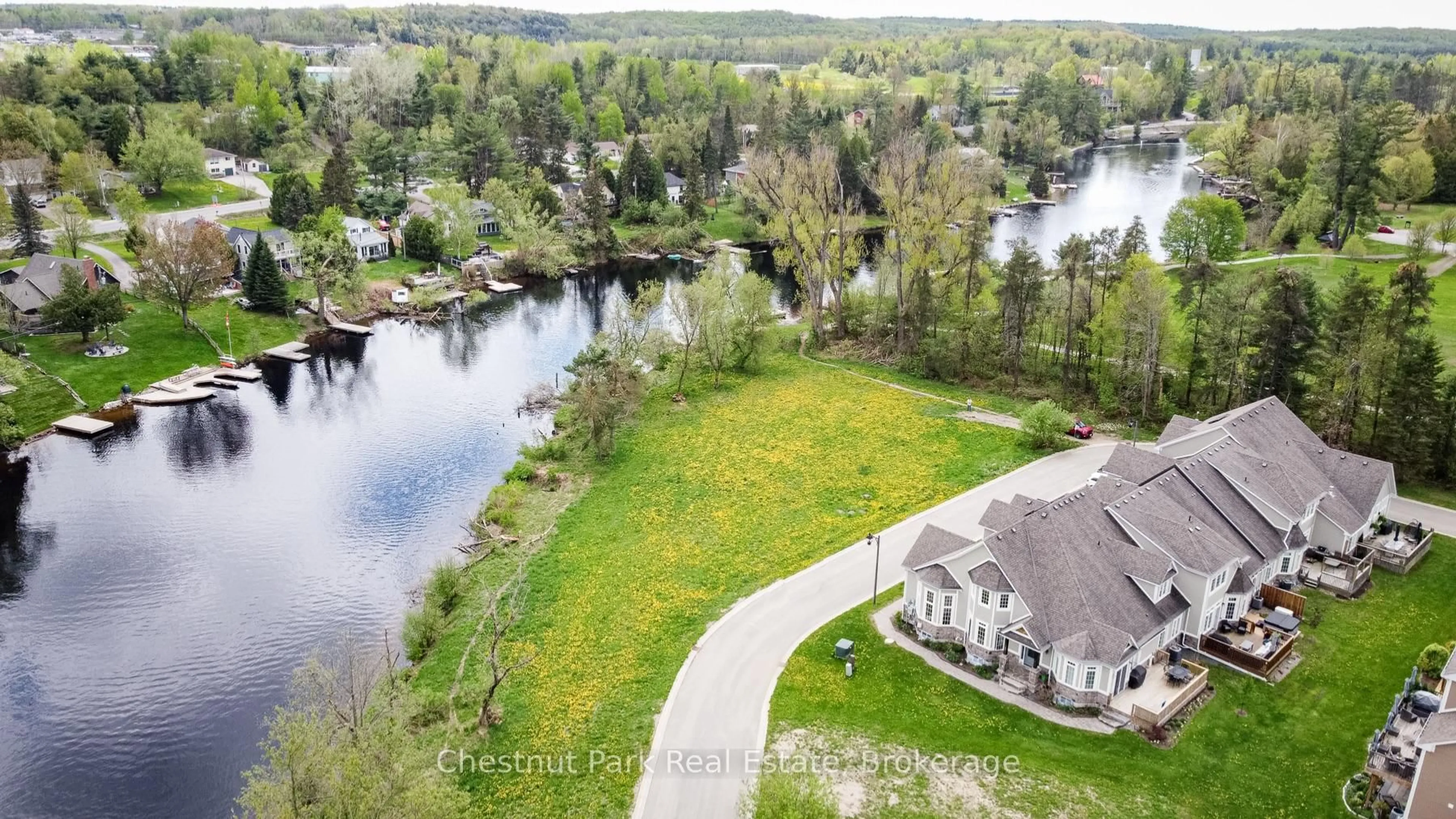 A pic from outside/outdoor area/front of a property/back of a property/a pic from drone, water/lake/river/ocean view for 24 Kent Cres, Bracebridge Ontario P1L 0B7