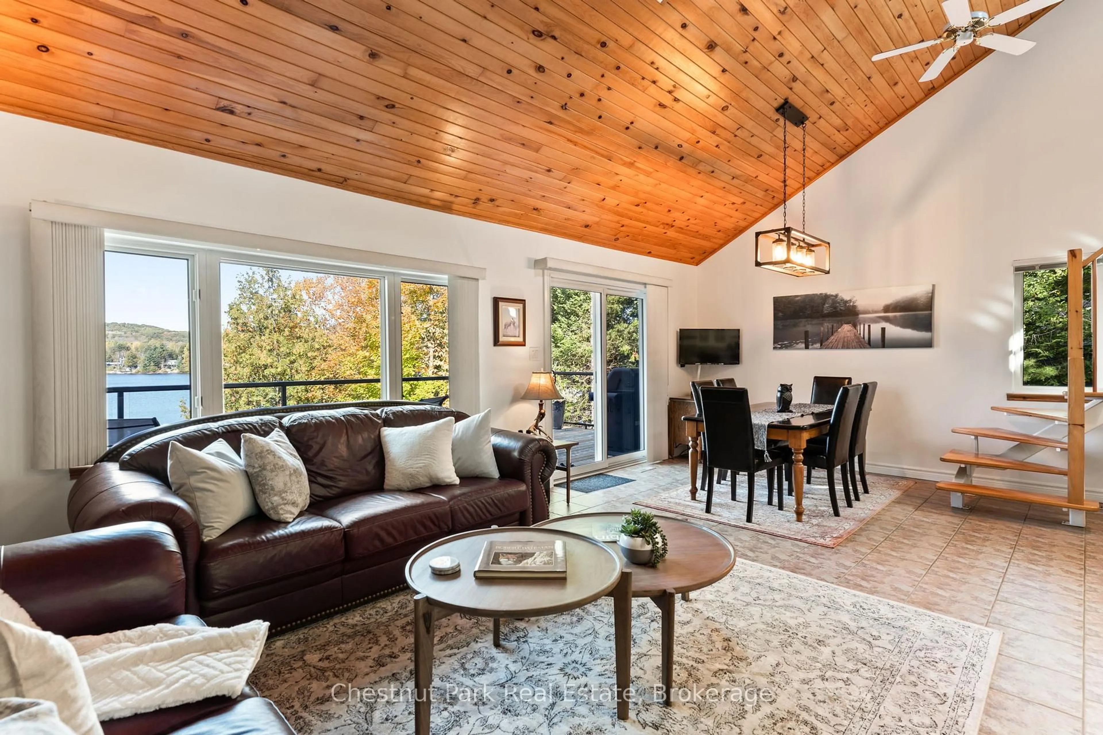 Living room with furniture, wood/laminate floor for 293 WEST DIAMOND LAKE Rd, Haliburton Ontario K0L 2A0