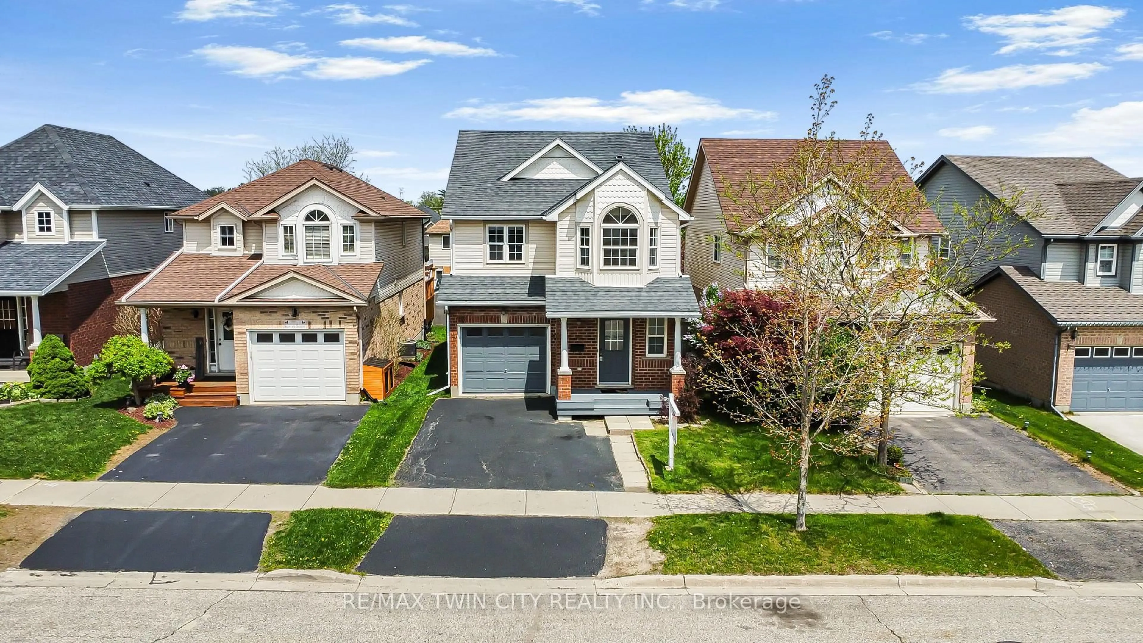 Home with brick exterior material, street for 74 Blue Lace Cres, Kitchener Ontario N2E 3X1