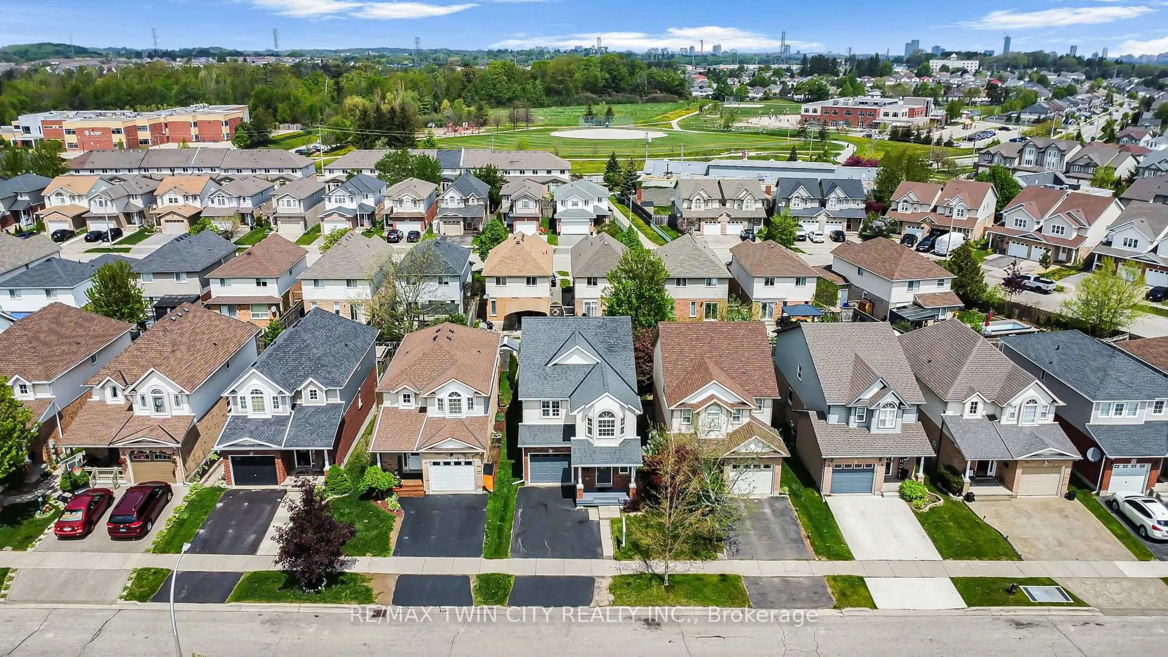A pic from outside/outdoor area/front of a property/back of a property/a pic from drone, street for 74 Blue Lace Cres, Kitchener Ontario N2E 3X1