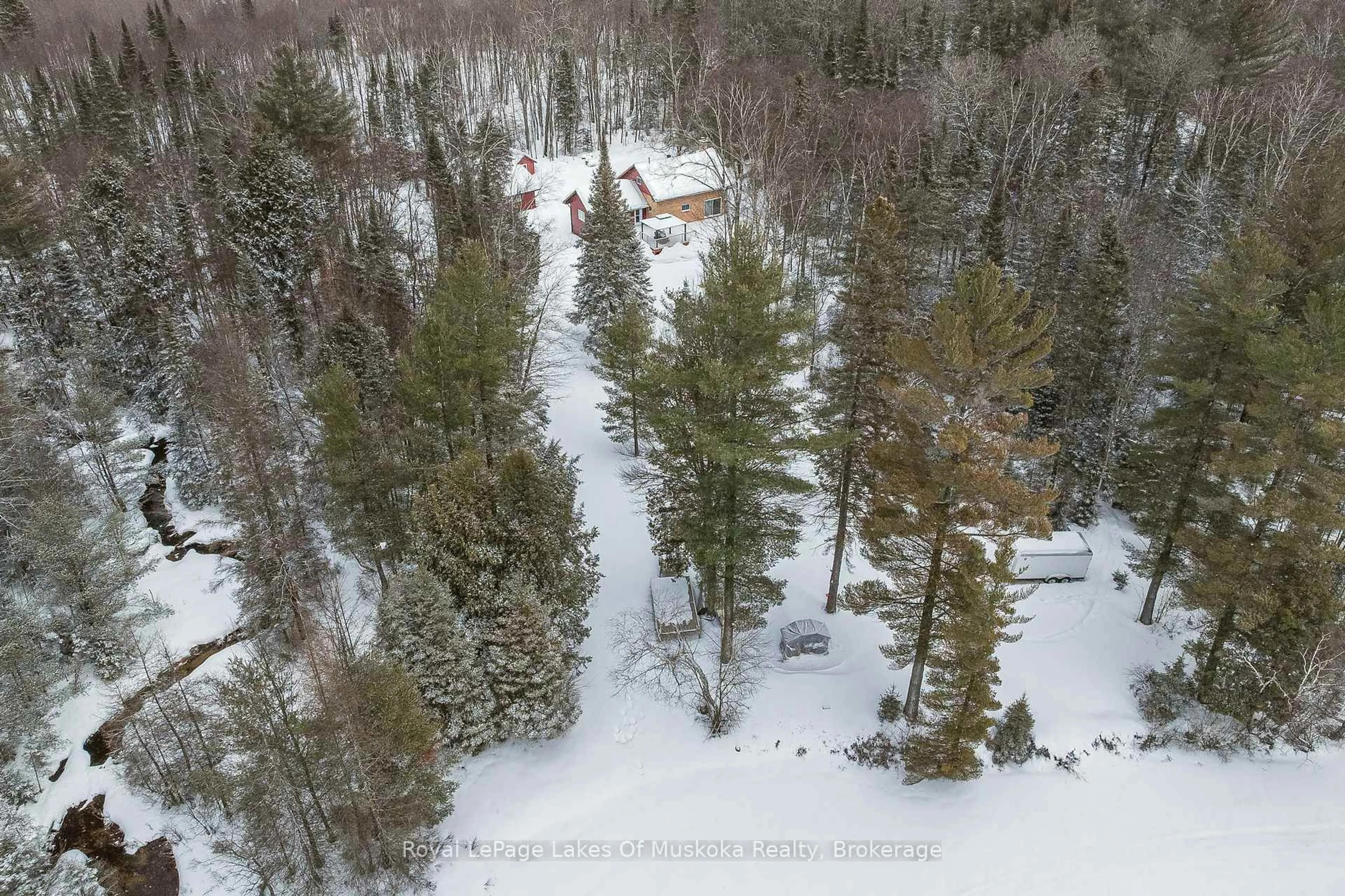 A pic from outside/outdoor area/front of a property/back of a property/a pic from drone, forest/trees view for 128 Cheer Lake Rd, Strong Ontario P0A 1X0