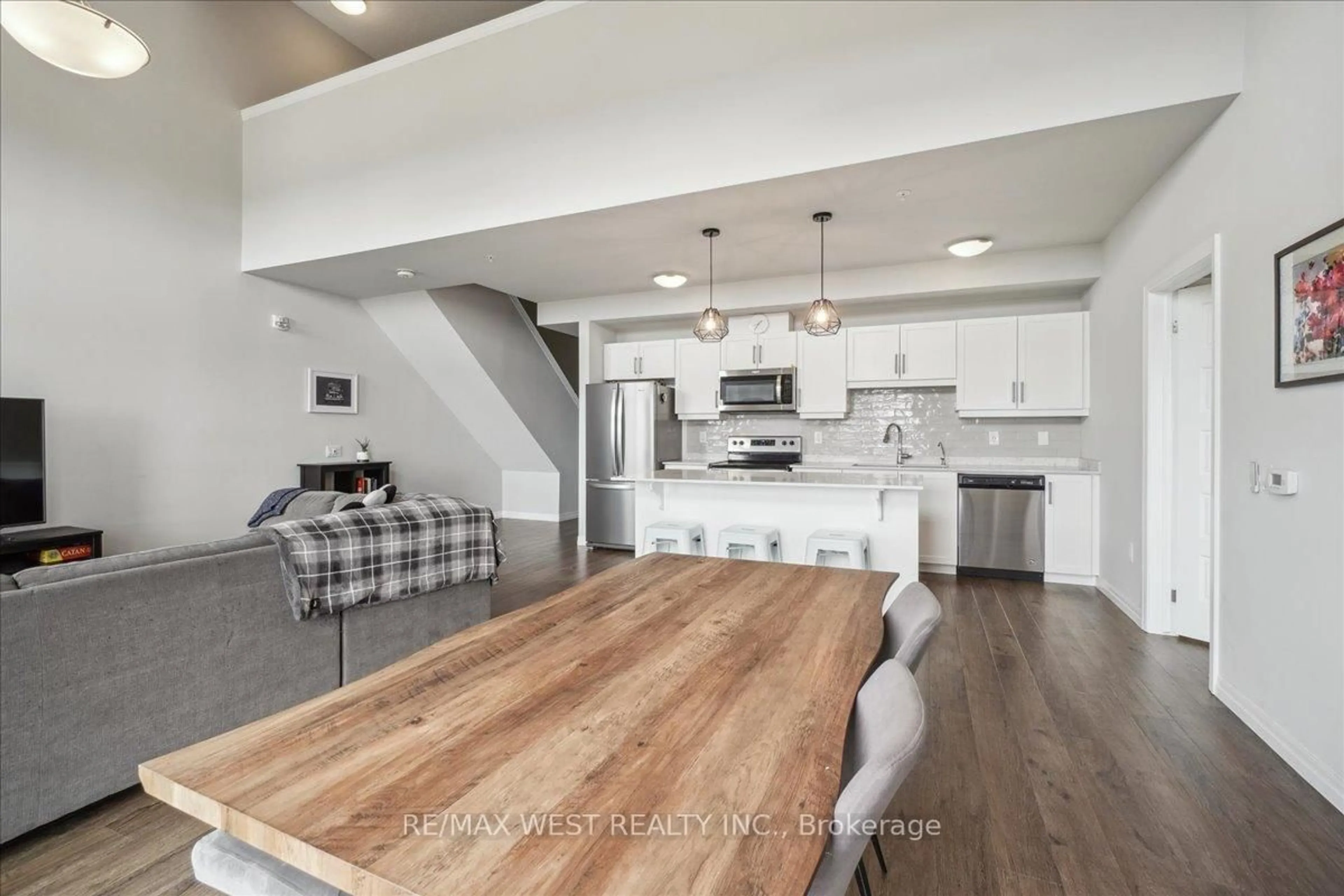 Open concept kitchen, wood/laminate floor for 35 Kingsbury Sq #413, Guelph Ontario N1L 0J4