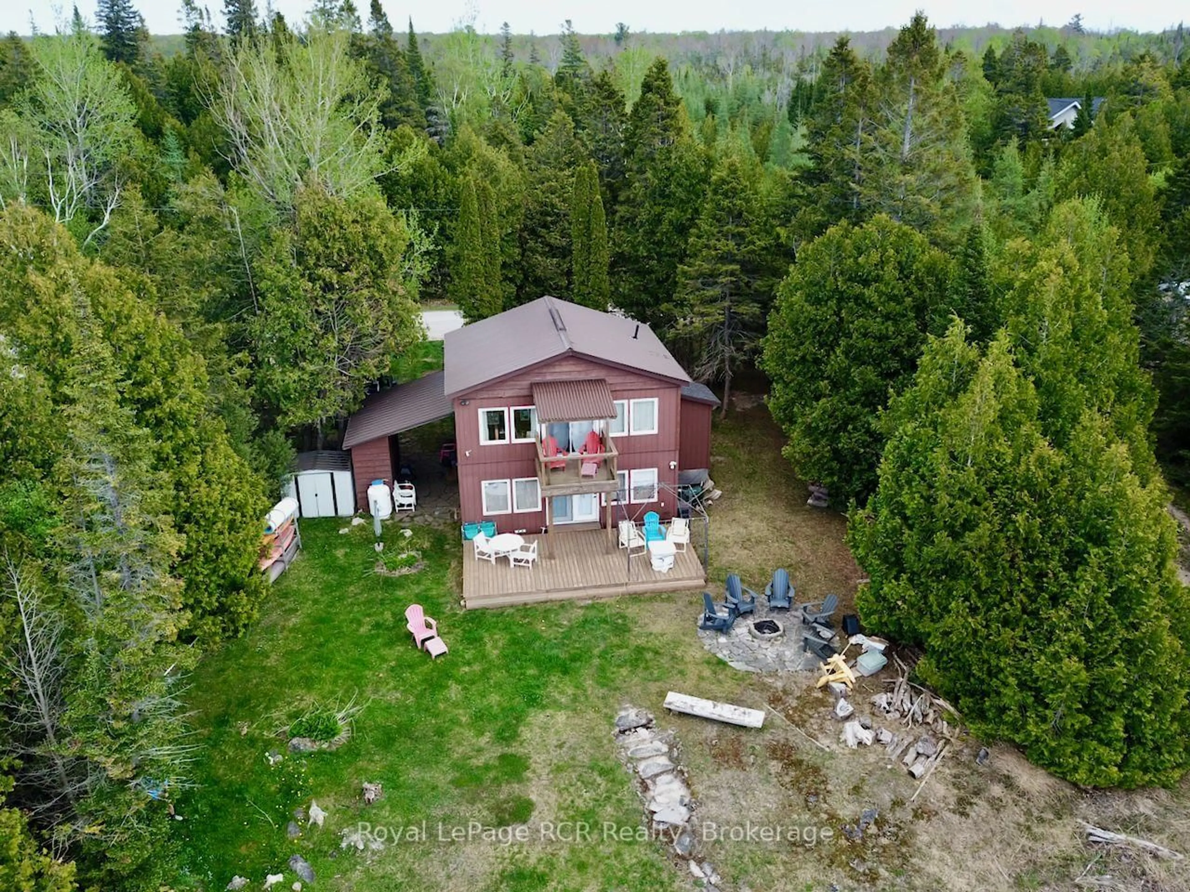 A pic from outside/outdoor area/front of a property/back of a property/a pic from drone, forest/trees view for 384 Bay St, South Bruce Peninsula Ontario N0H 2T0