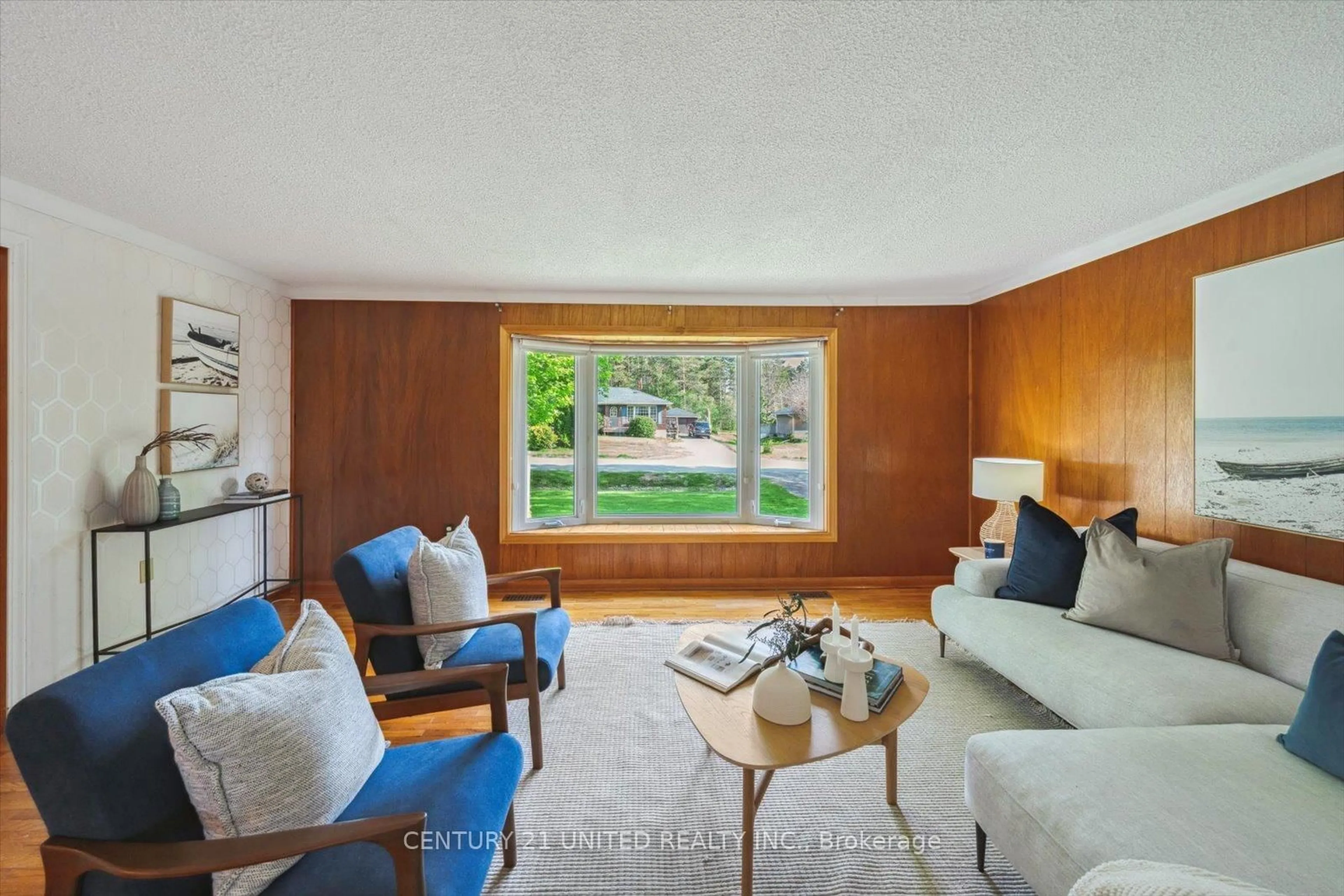 Living room with furniture, wood/laminate floor for 186 Coral Dr, Douro-Dummer Ontario K9L 1A5
