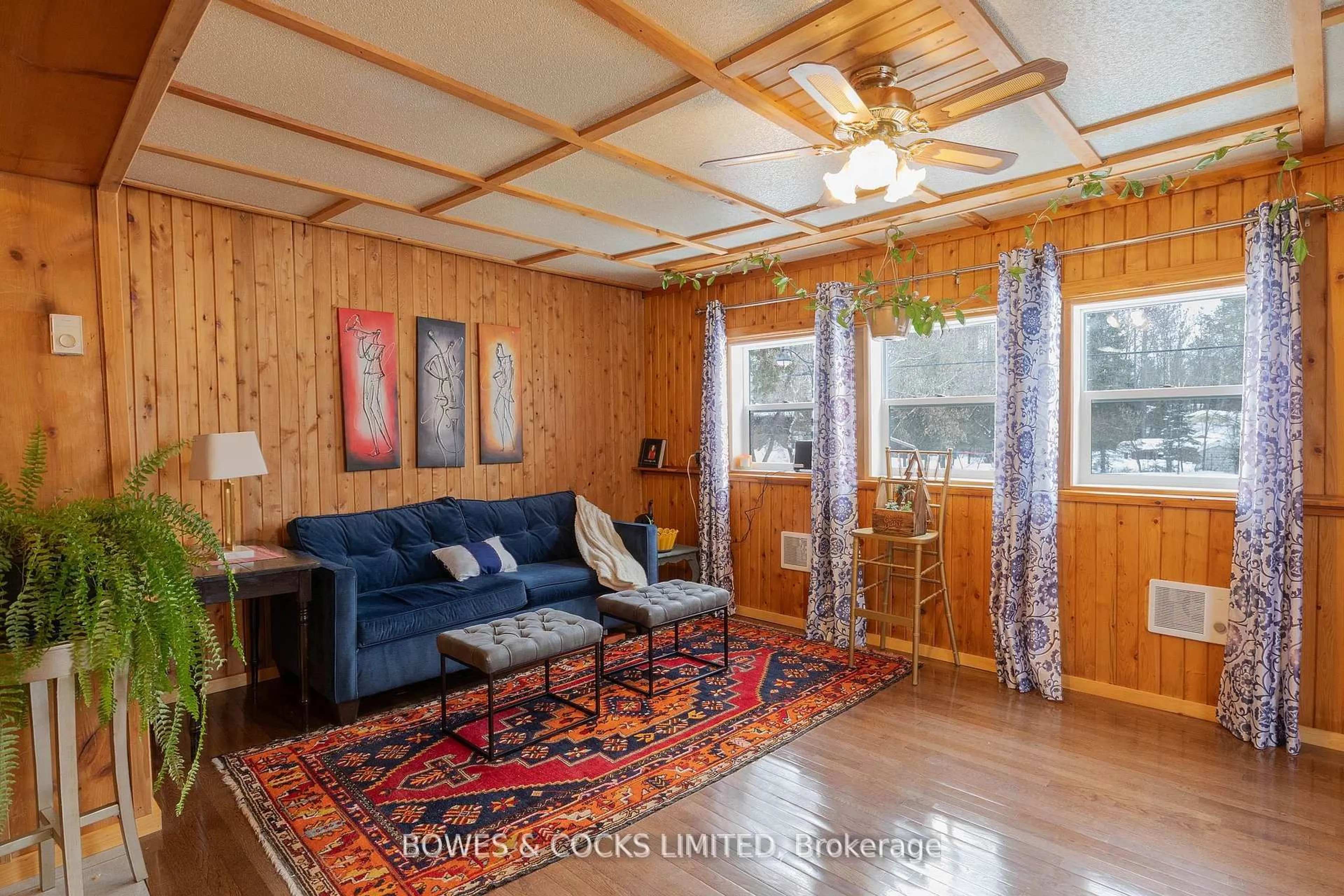 Living room with furniture, wood/laminate floor for 5490 Highway 620, Coe Hill Ontario K0L 1P0