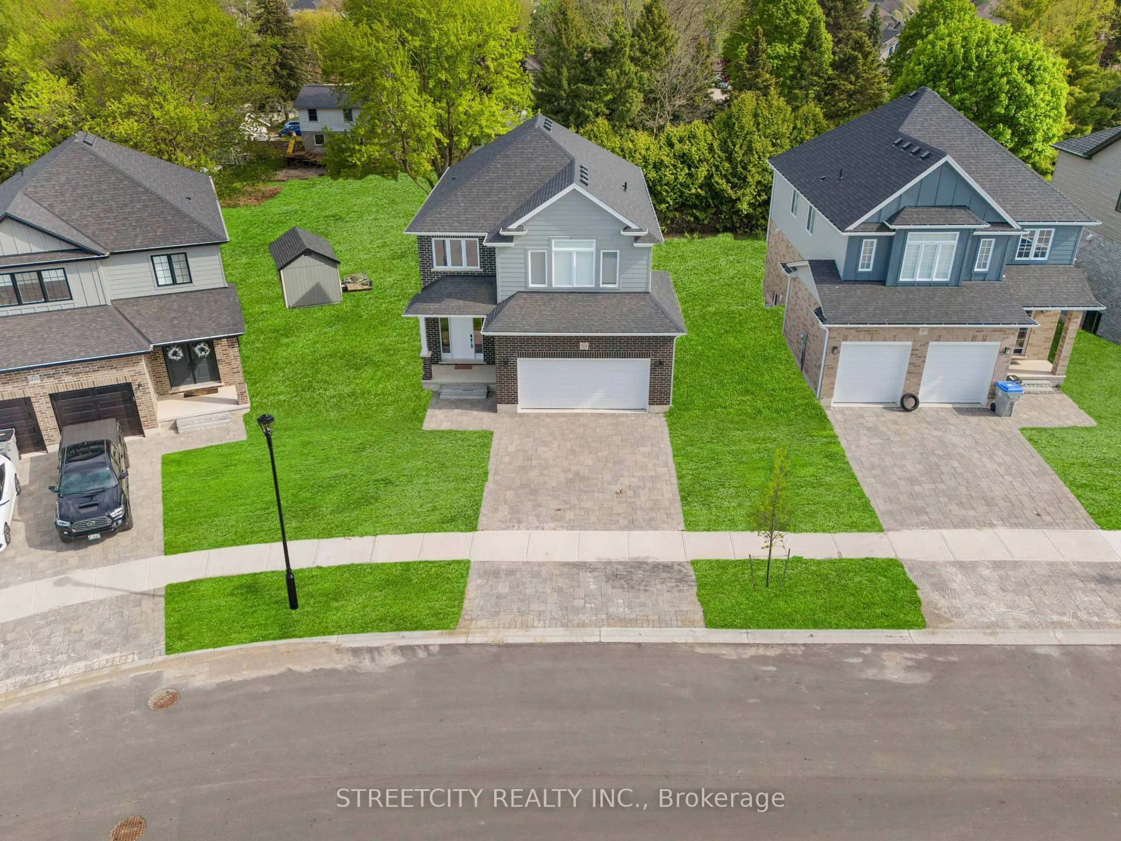 A pic from outside/outdoor area/front of a property/back of a property/a pic from drone, street for 101 Basil Cres, Middlesex Centre Ontario N0M 2A0