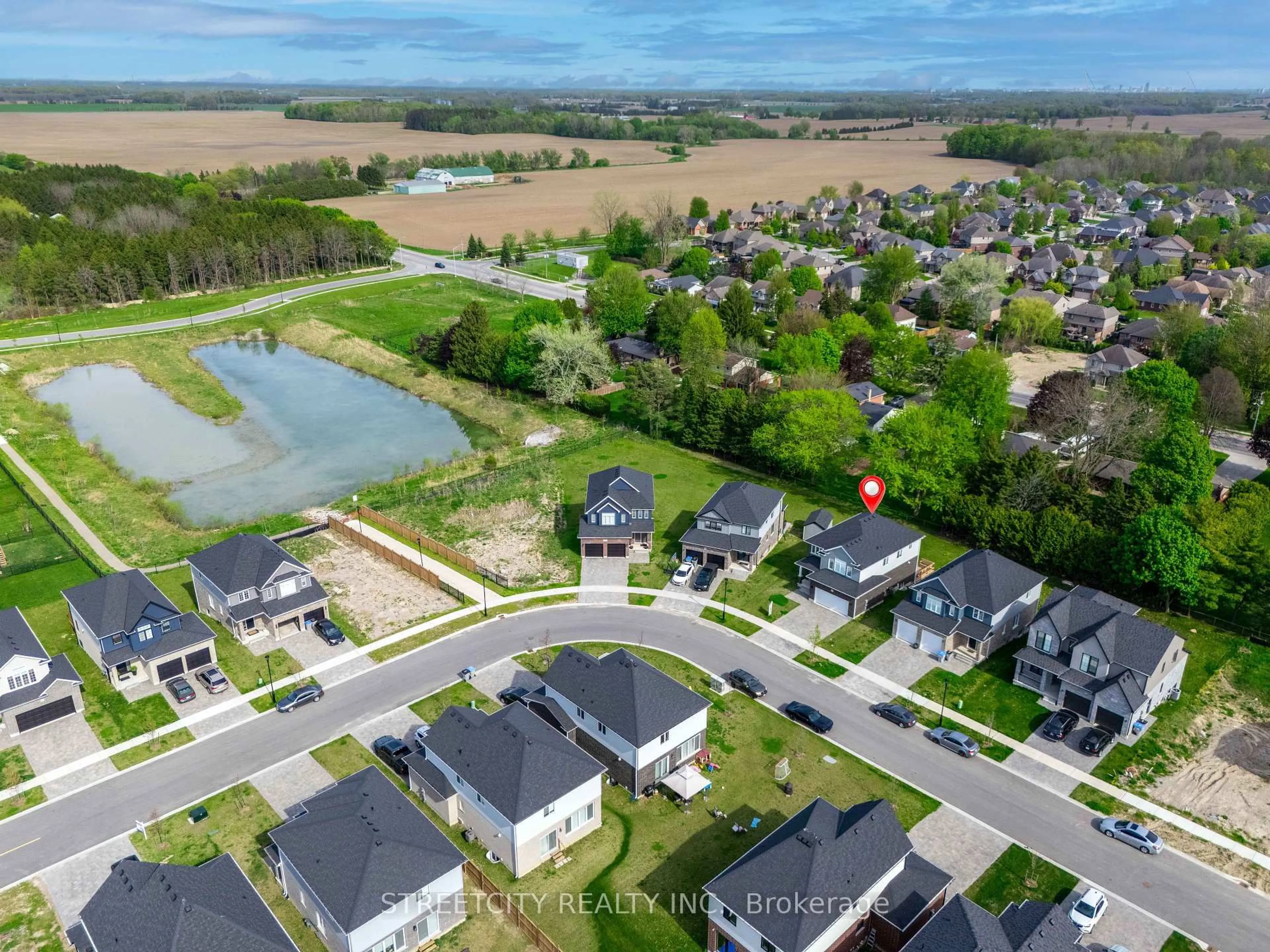 A pic from outside/outdoor area/front of a property/back of a property/a pic from drone, water/lake/river/ocean view for 101 Basil Cres, Middlesex Centre Ontario N0M 2A0