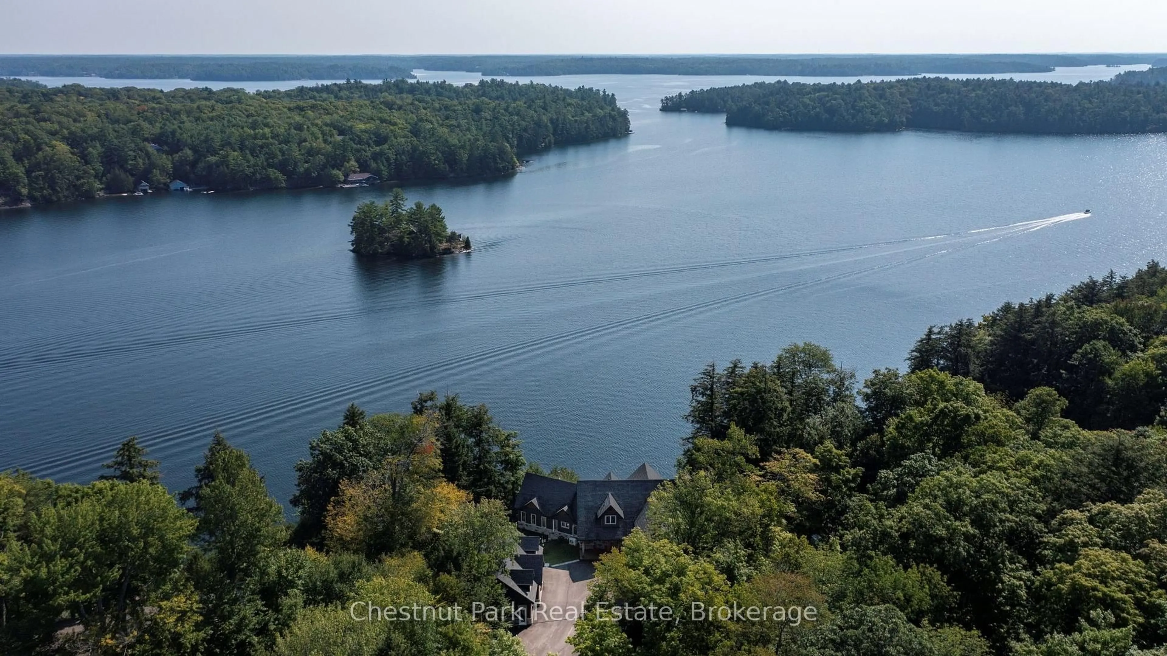 A pic from outside/outdoor area/front of a property/back of a property/a pic from drone, water/lake/river/ocean view for 15 Gordon Point Lane, Seguin Ontario P0C 1H0