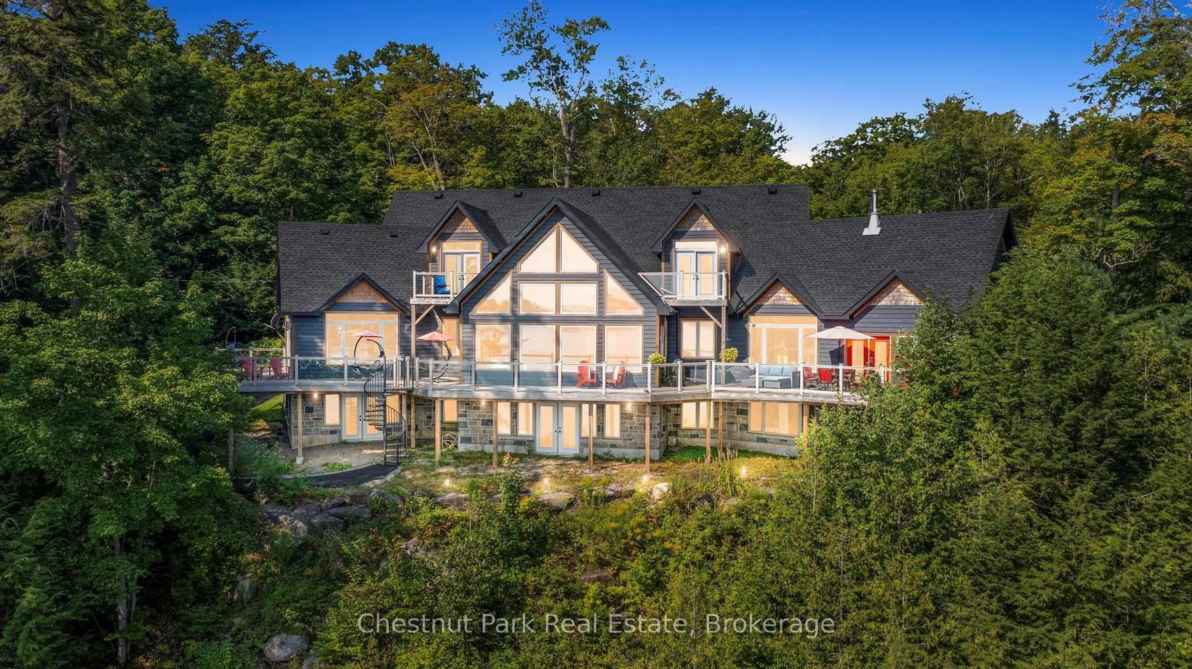A pic from outside/outdoor area/front of a property/back of a property/a pic from drone, water/lake/river/ocean view for 15 Gordon Point Lane, Seguin Ontario P0C 1H0