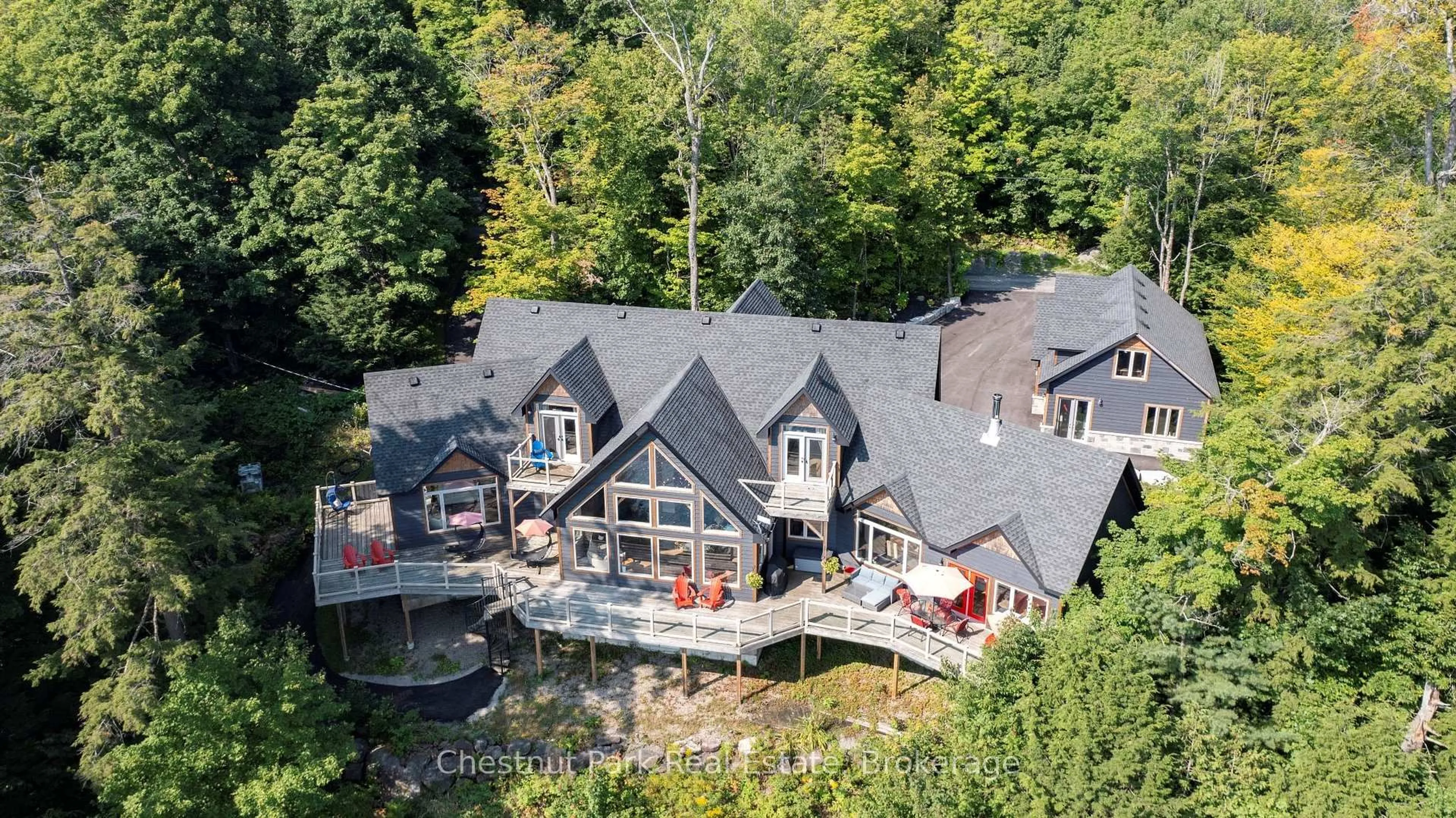 A pic from outside/outdoor area/front of a property/back of a property/a pic from drone, water/lake/river/ocean view for 15 Gordon Point Lane, Seguin Ontario P0C 1H0
