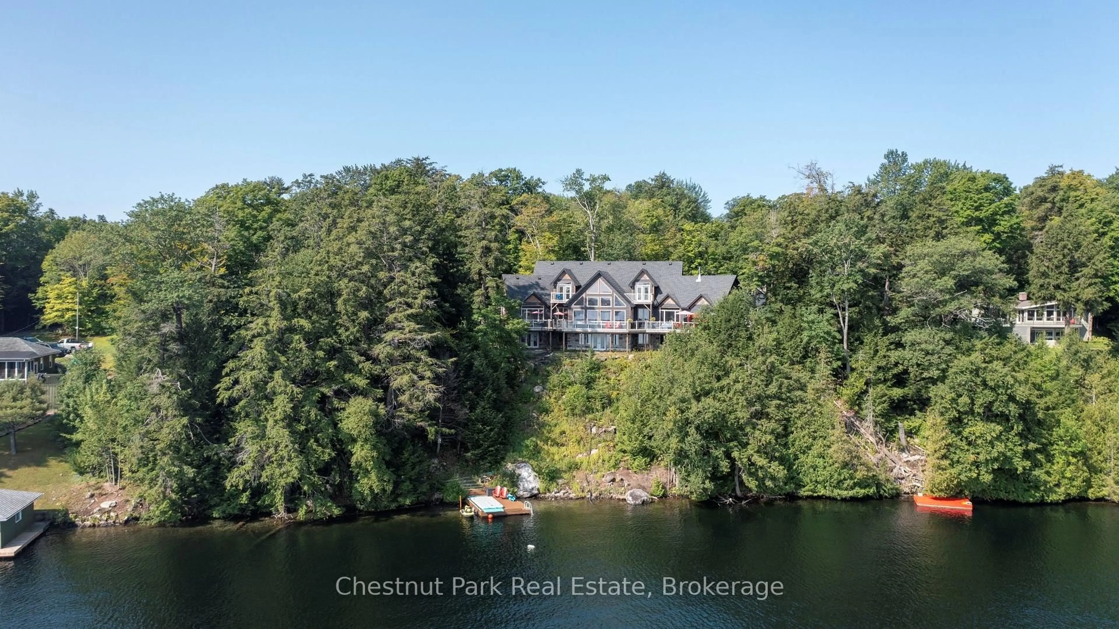 A pic from outside/outdoor area/front of a property/back of a property/a pic from drone, water/lake/river/ocean view for 15 Gordon Point Lane, Seguin Ontario P0C 1H0