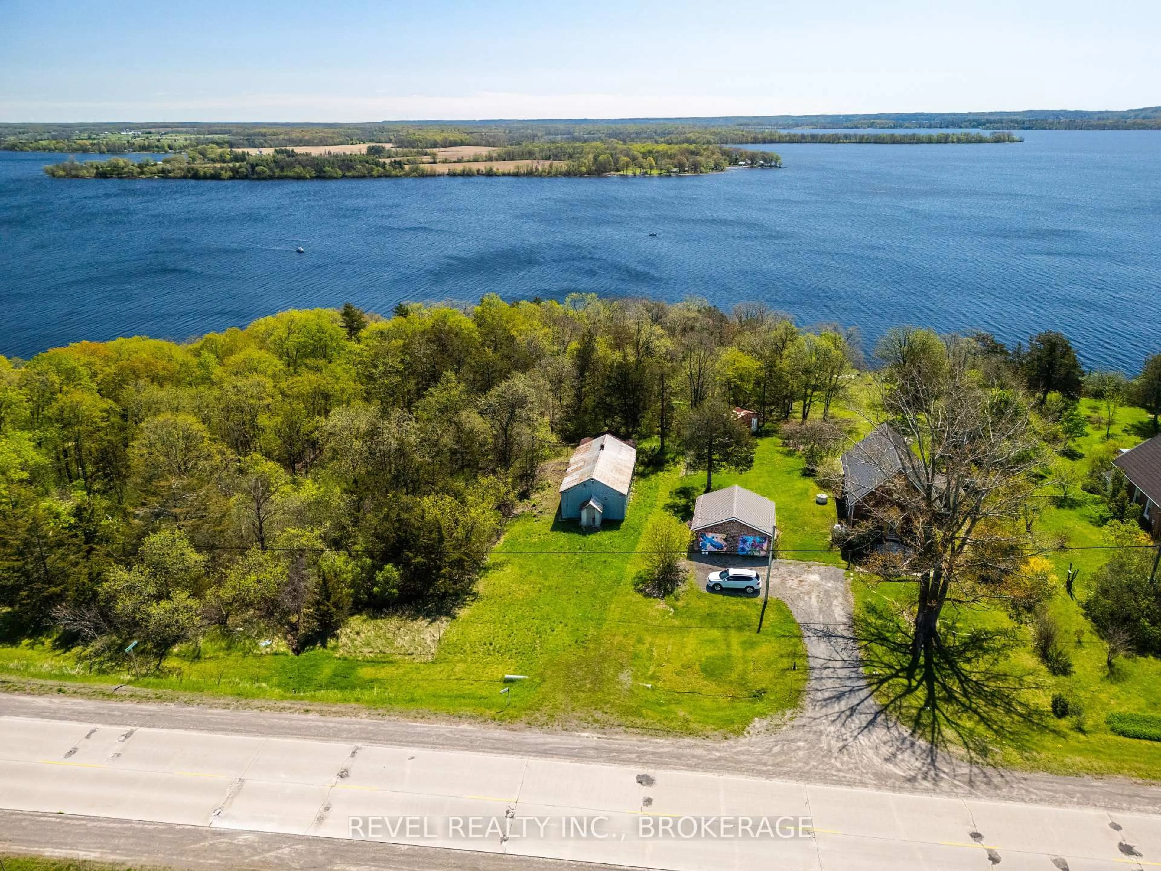 A pic from outside/outdoor area/front of a property/back of a property/a pic from drone, water/lake/river/ocean view for 2186 Highway 49 Highway, Prince Edward County Ontario K0K 2T0