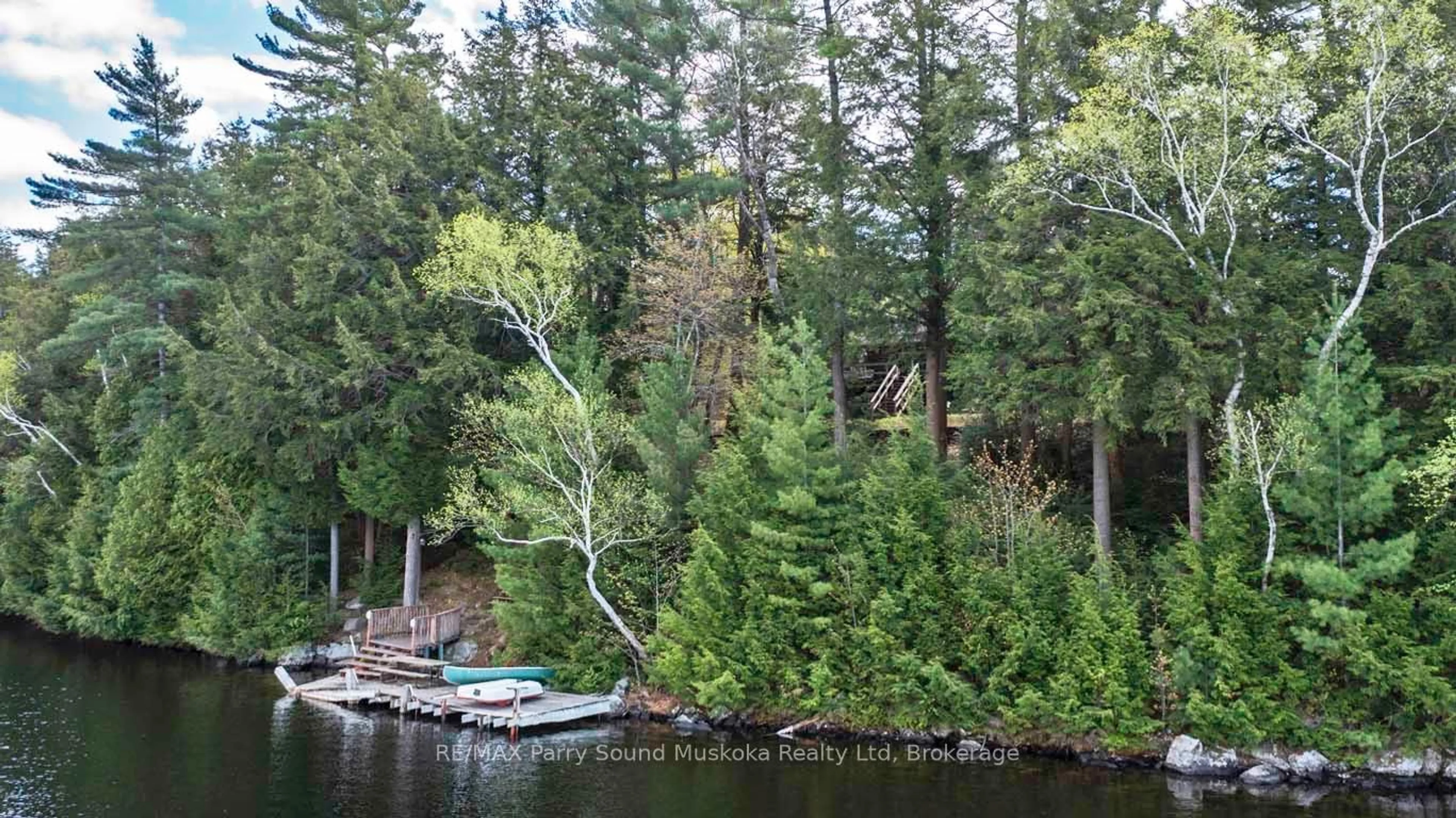 A pic from outside/outdoor area/front of a property/back of a property/a pic from drone, water/lake/river/ocean view for 33 Houston Lane, Seguin Ontario P2A 0B2