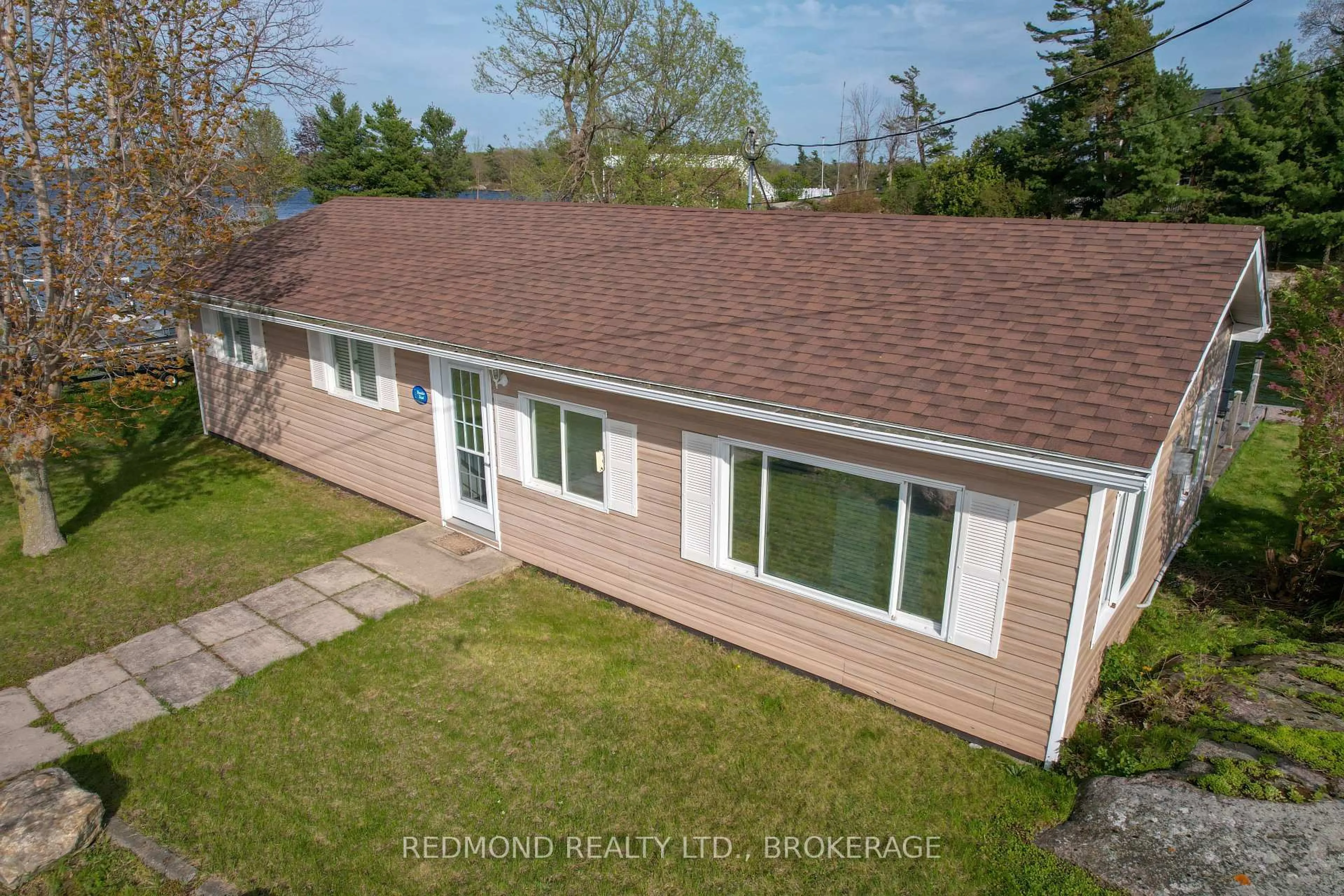 A pic from outside/outdoor area/front of a property/back of a property/a pic from drone, street for 396 Howe Island Ferry Rd, Gananoque Ontario K7G 2V5