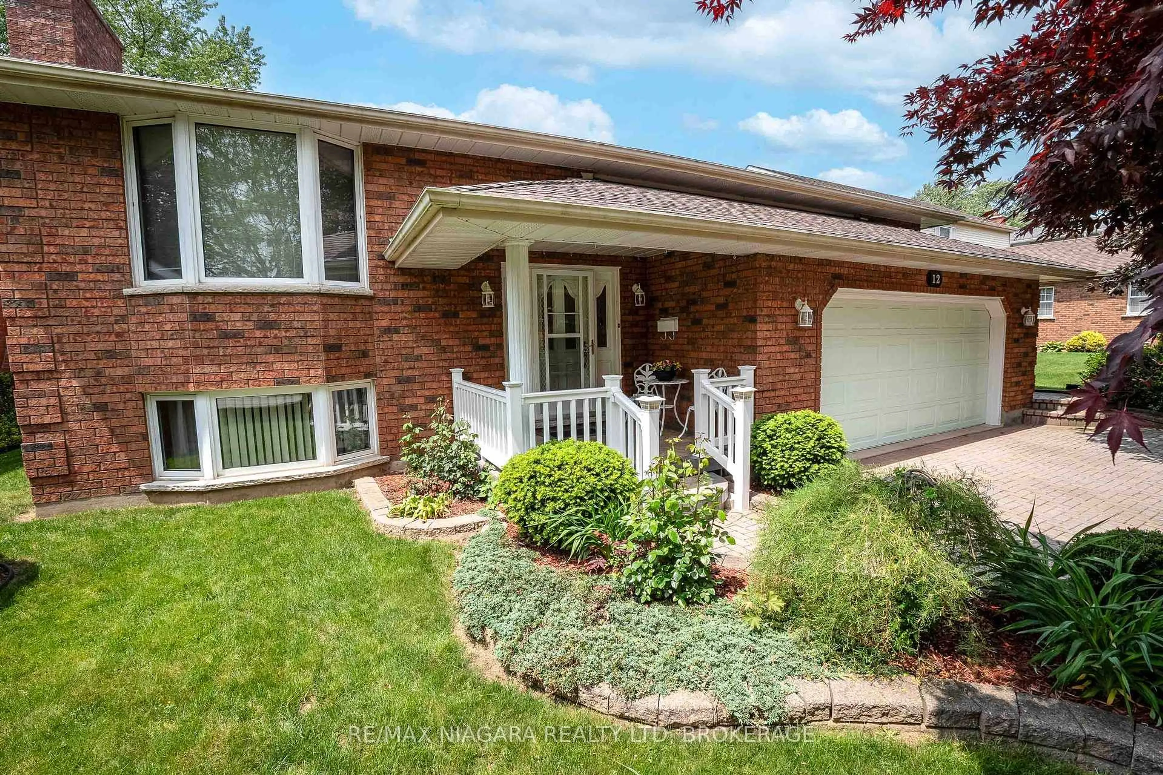 Home with brick exterior material, street for 12 Fern Gate, Pelham Ontario L0S 1E4