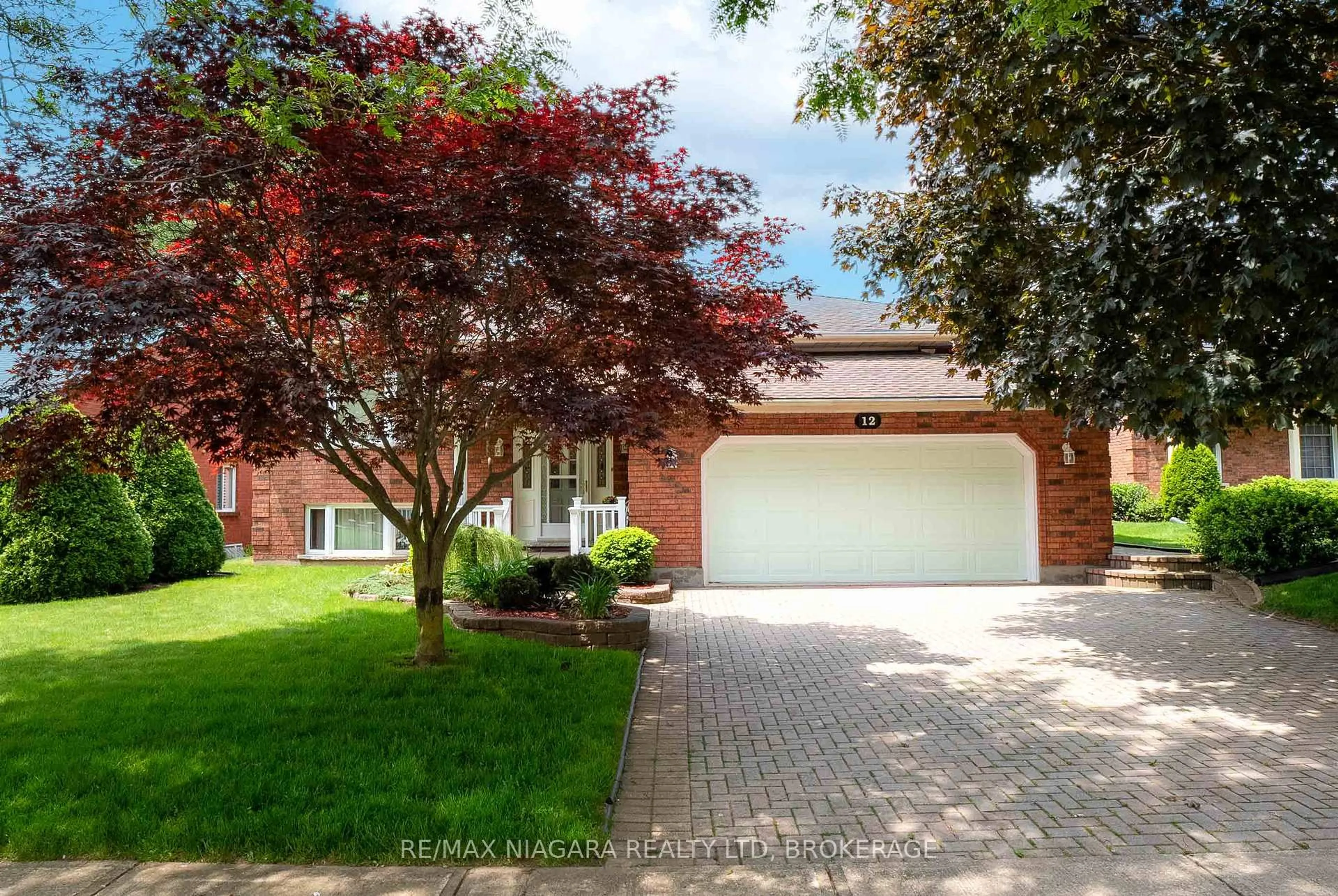 Home with brick exterior material, street for 12 Fern Gate, Pelham Ontario L0S 1E4