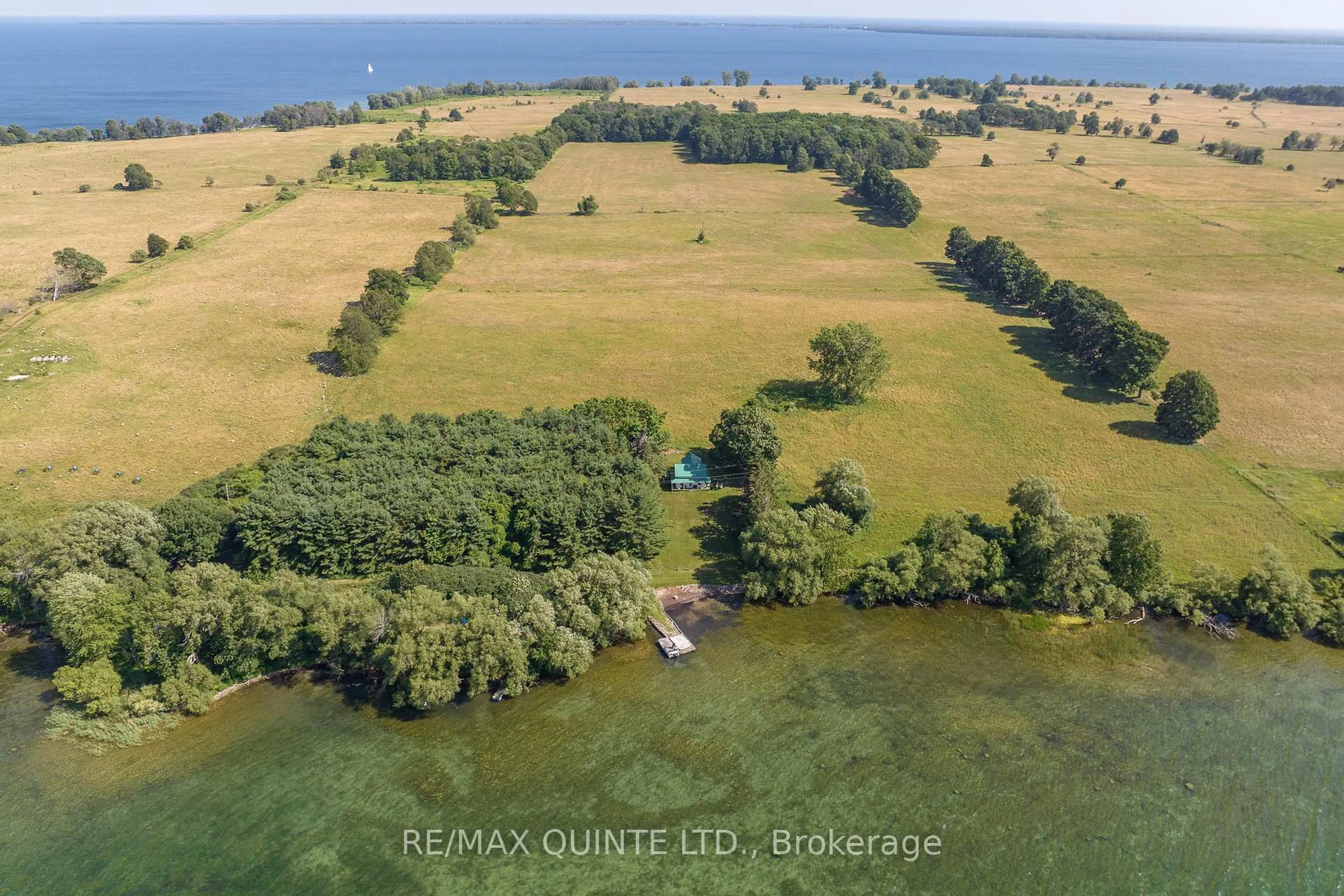 A pic from outside/outdoor area/front of a property/back of a property/a pic from drone, water/lake/river/ocean view for 562 WAUPOOS ISLAND Lane, Prince Edward County Ontario K0K 2T0