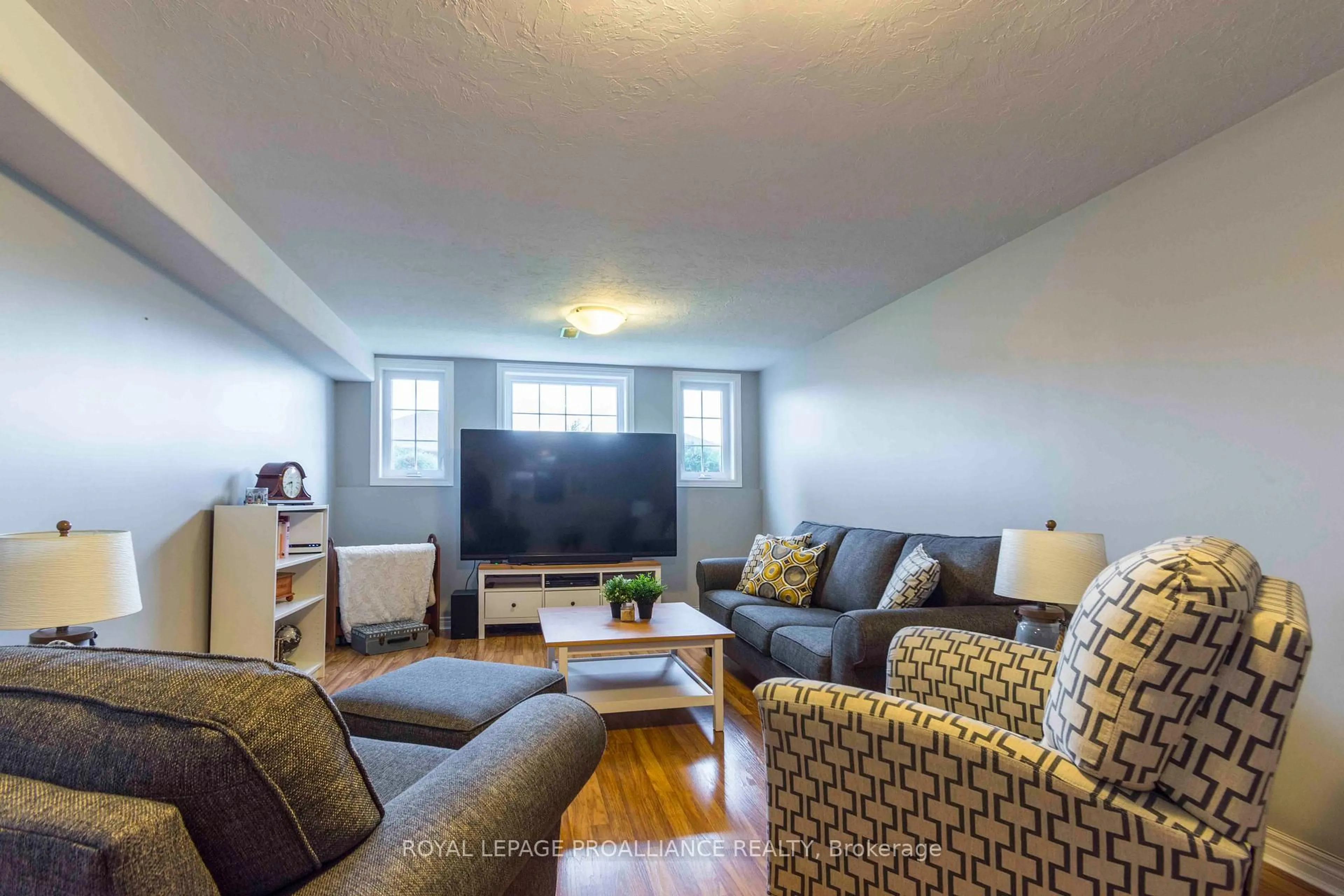 Living room with furniture, wood/laminate floor for 35 Belvedere Rd, Quinte West Ontario K8V 4A9