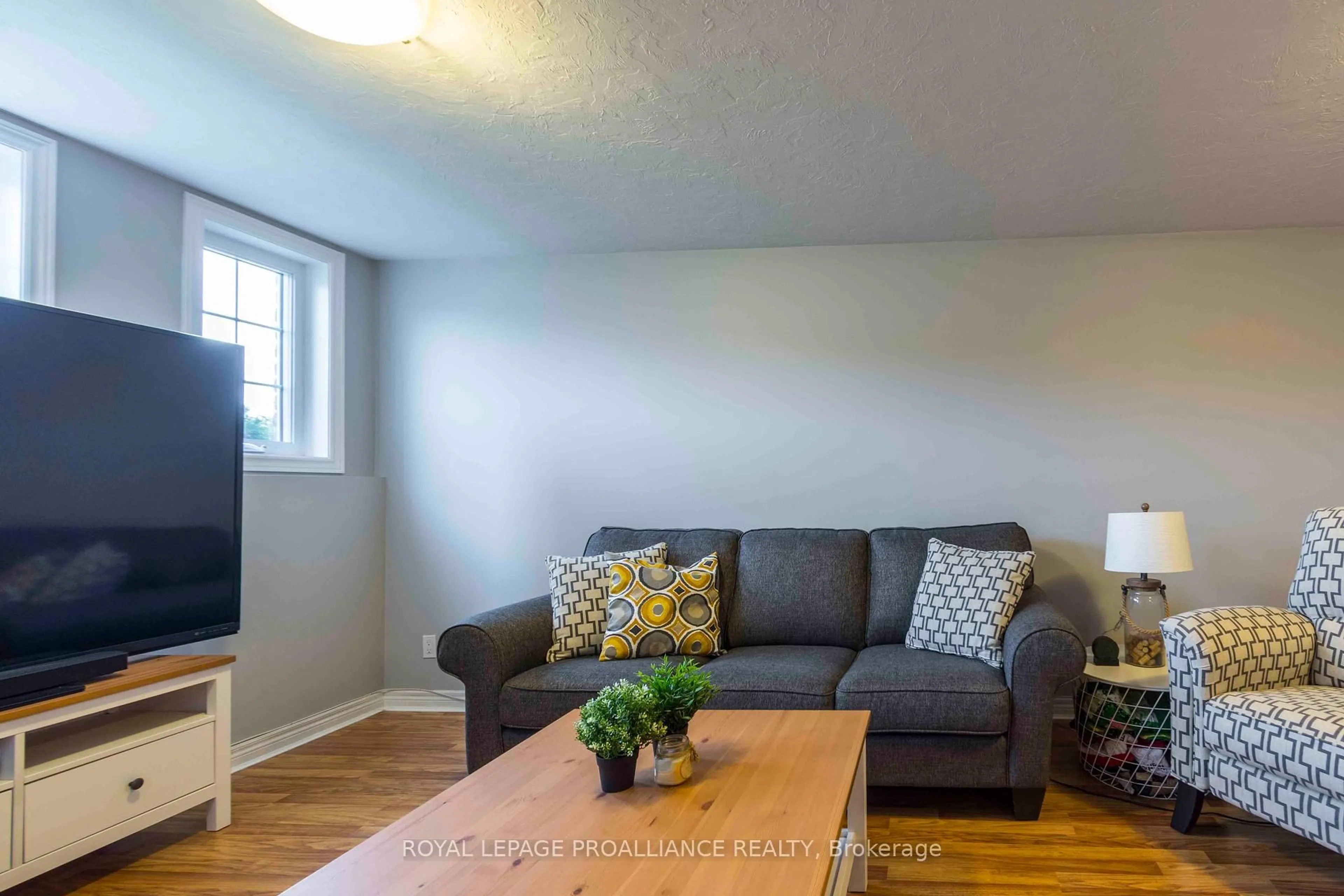Living room with furniture, wood/laminate floor for 35 Belvedere Rd, Quinte West Ontario K8V 4A9