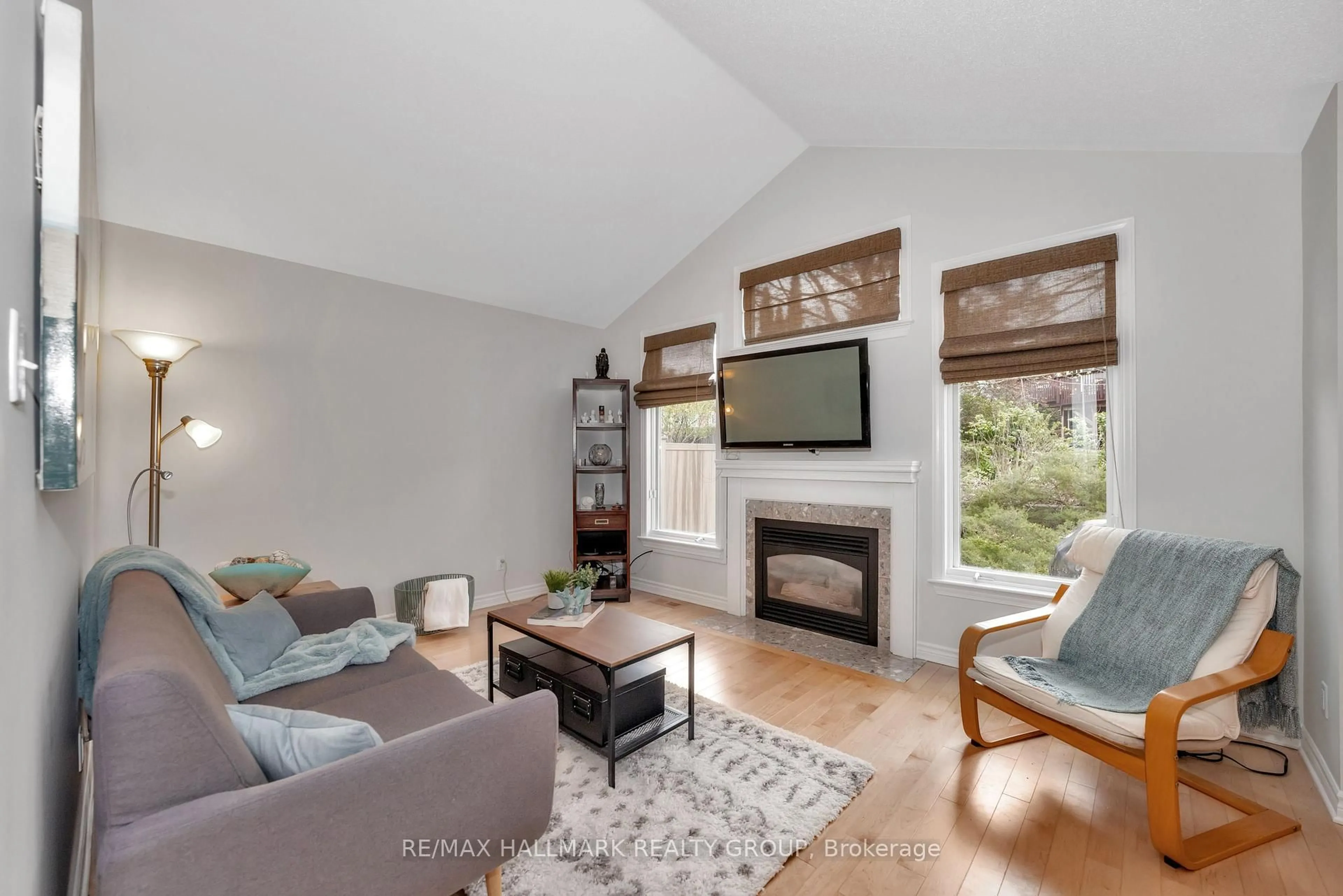 Living room with furniture, wood/laminate floor for 61 Kimberwick Cres, Ottawa Ontario K1V 0W6