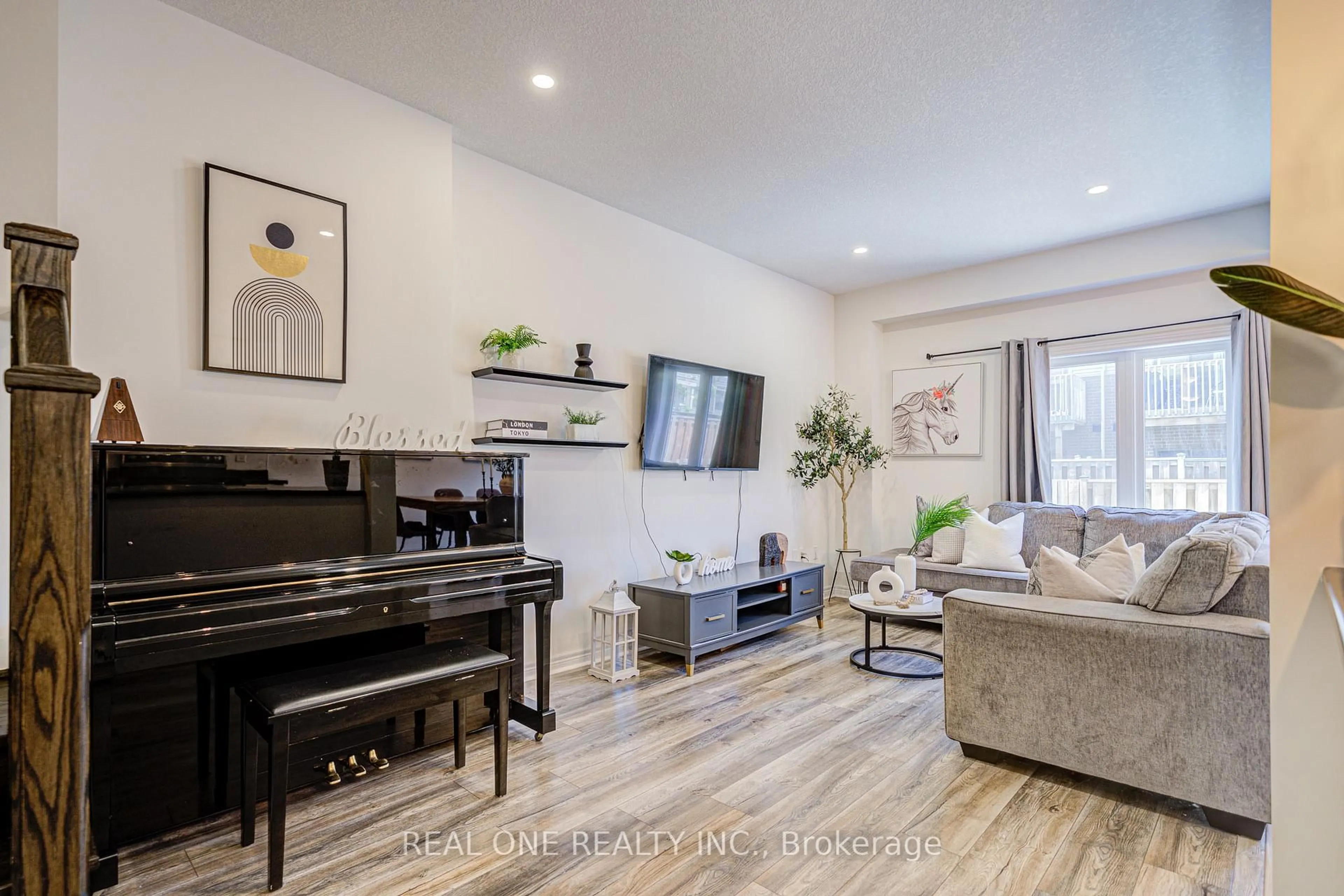 Living room with furniture, wood/laminate floor for 31 Garlent Ave, Hamilton Ontario L9K 0J9