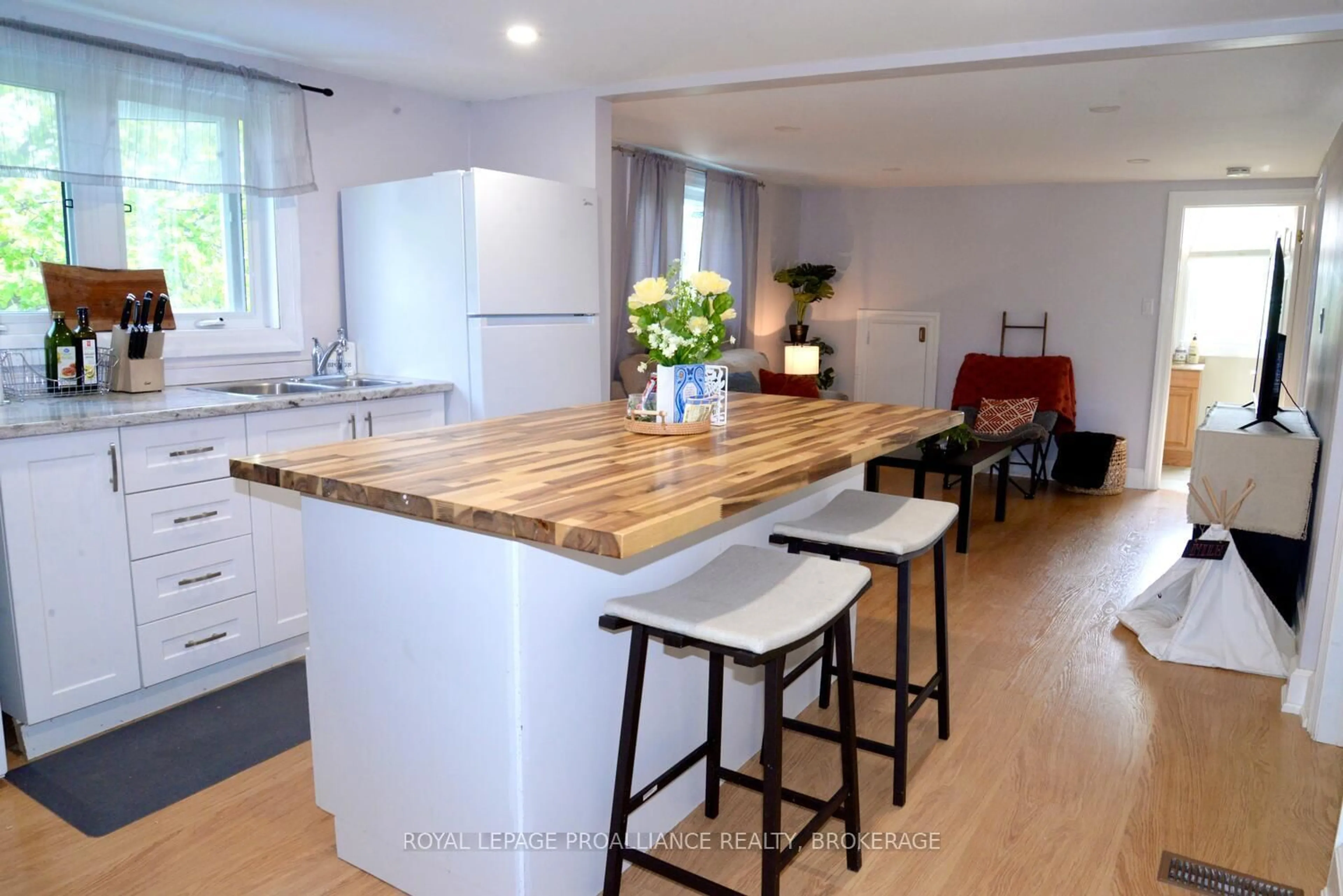 Open concept kitchen, wood/laminate floor for 19 Folger St, Kingston Ontario K7K 4Y7