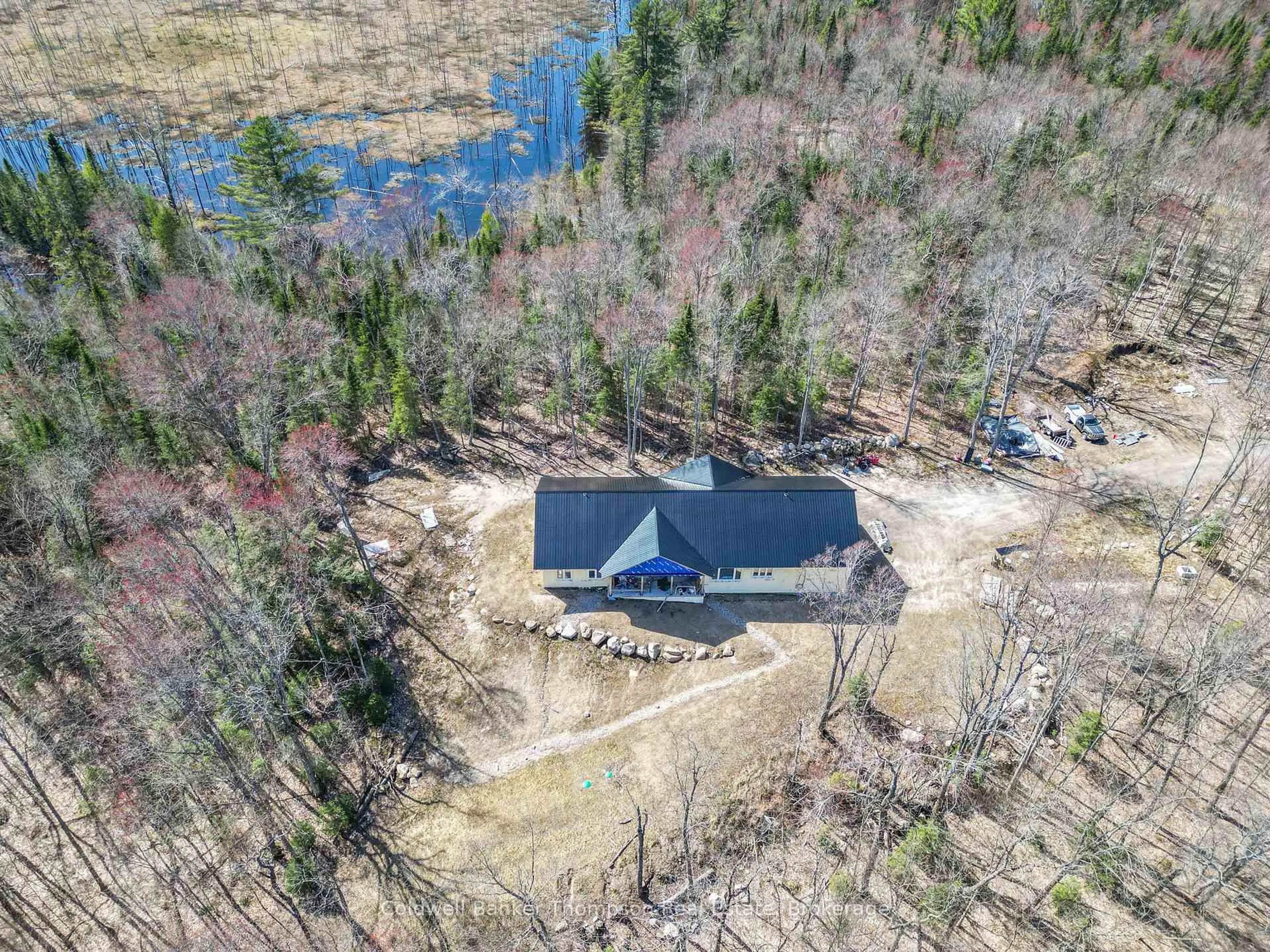 A pic from outside/outdoor area/front of a property/back of a property/a pic from drone, water/lake/river/ocean view for 121 Loon Lake Rd, Magnetawan Ontario P0A 1Z0