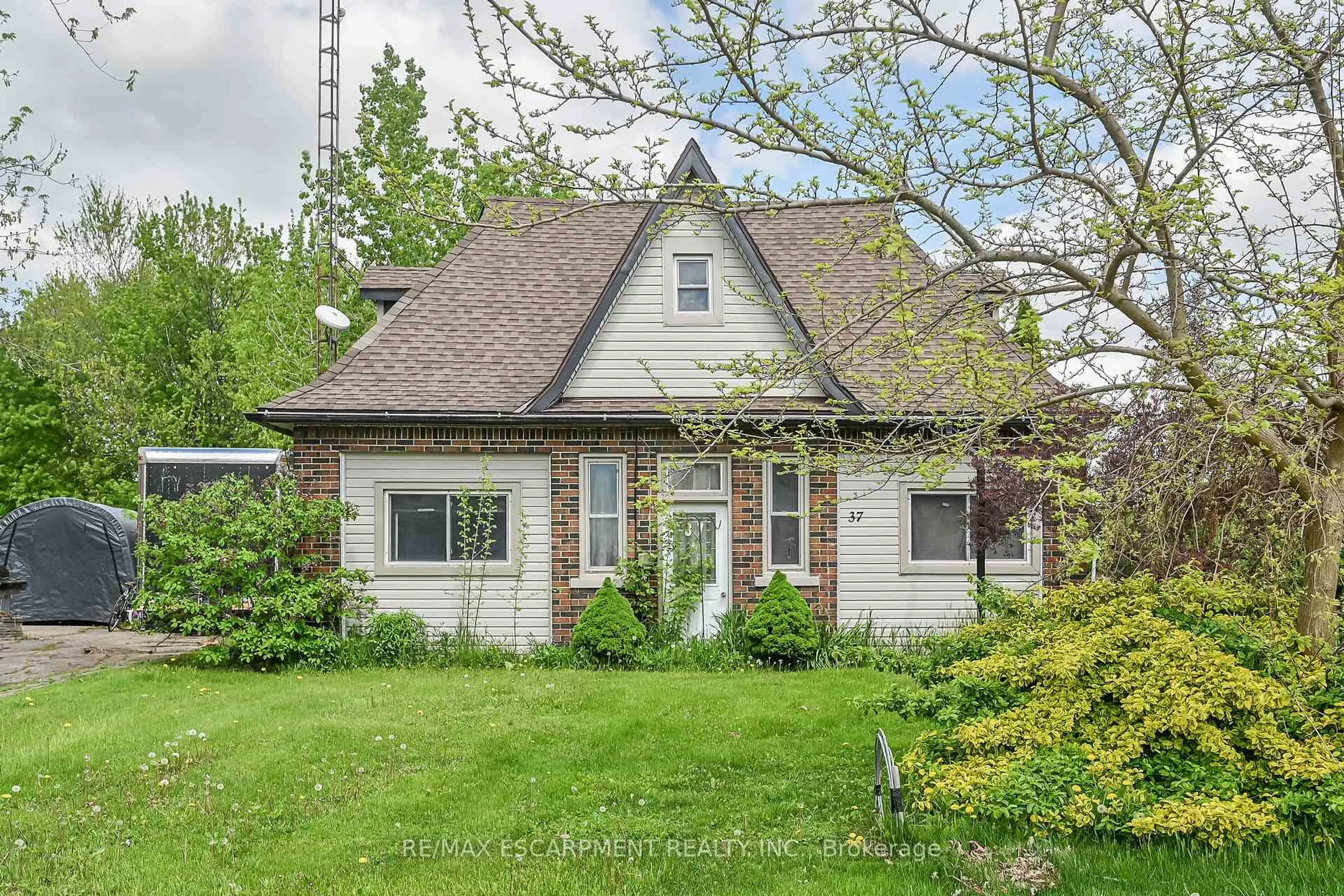 Home with brick exterior material, street for 37 TALBOT Rd, Haldimand Ontario N0A 1C0