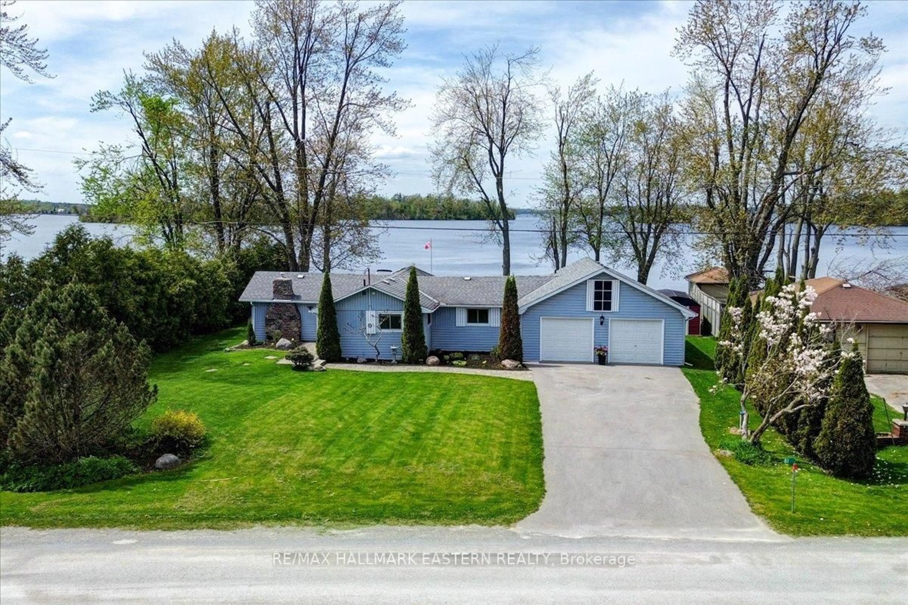 A pic from outside/outdoor area/front of a property/back of a property/a pic from drone, water/lake/river/ocean view for 81 Lakeshore Blvd, Selwyn Ontario K0L 1T0