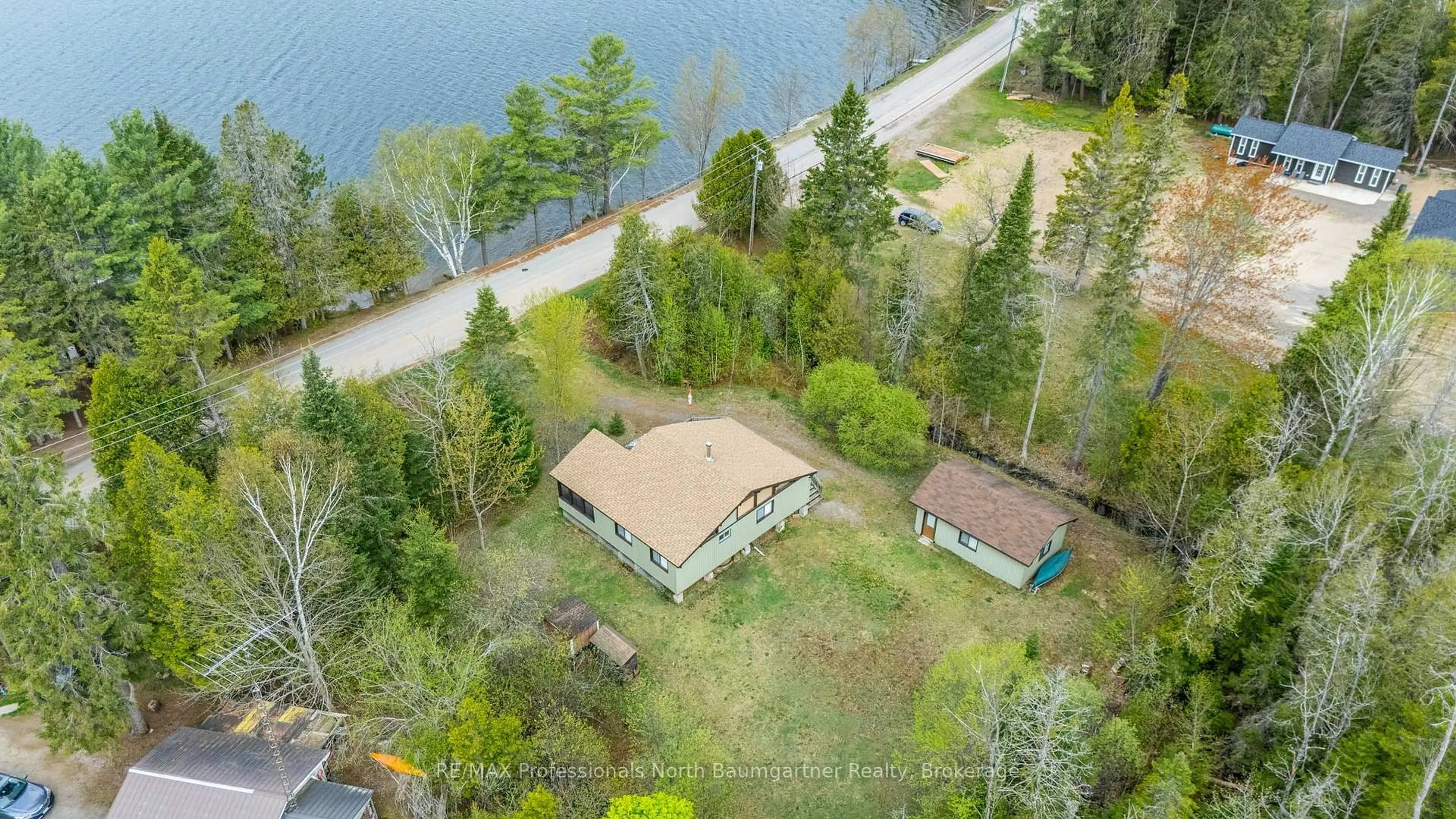 A pic from outside/outdoor area/front of a property/back of a property/a pic from drone, water/lake/river/ocean view for 1172 Maebar Rd, Minden Hills Ontario K0M 2K0
