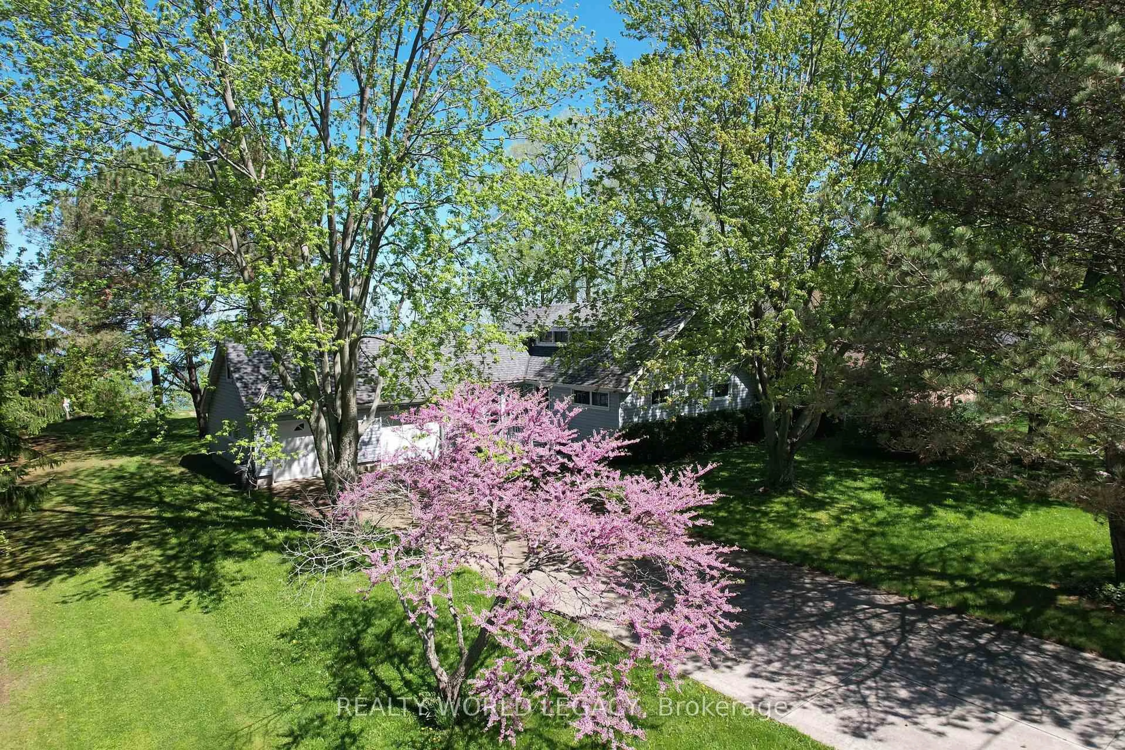 A pic from outside/outdoor area/front of a property/back of a property/a pic from drone, street for 4718 Lakeside St, Plympton-Wyoming Ontario N0N 1J6