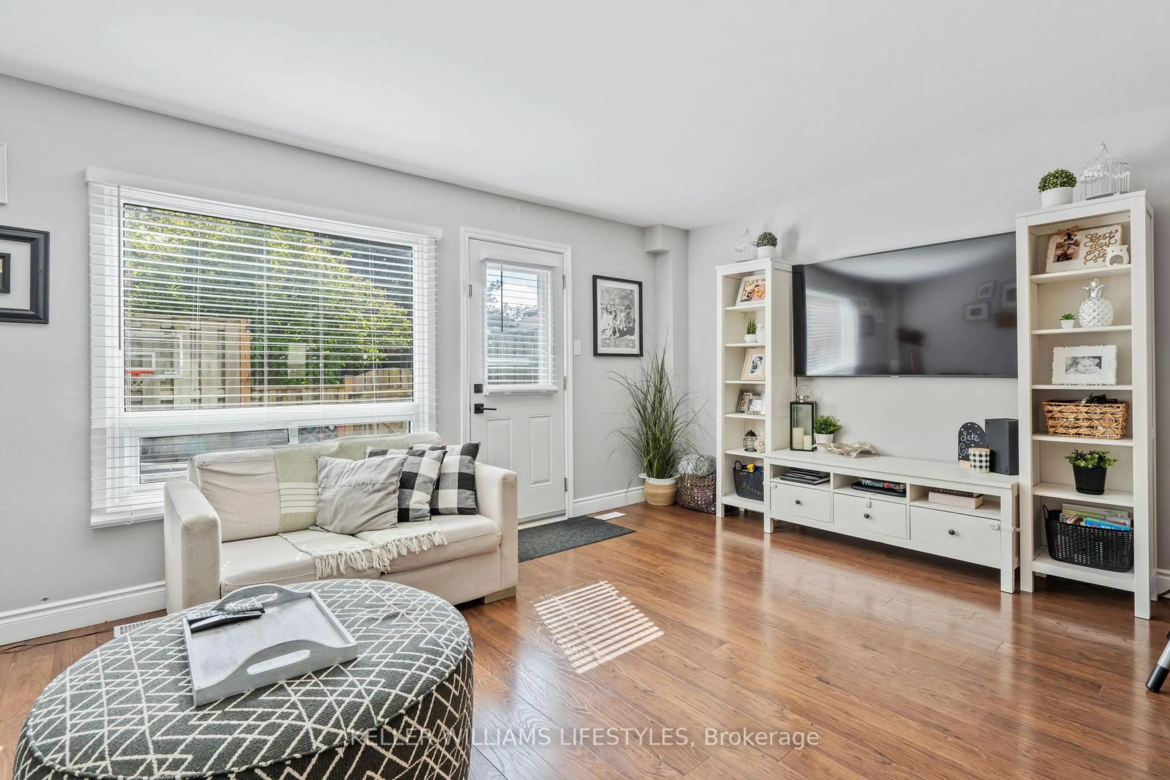 Living room with furniture, wood/laminate floor for 166 Southdale Rd #9, London South Ontario N6J 2J1