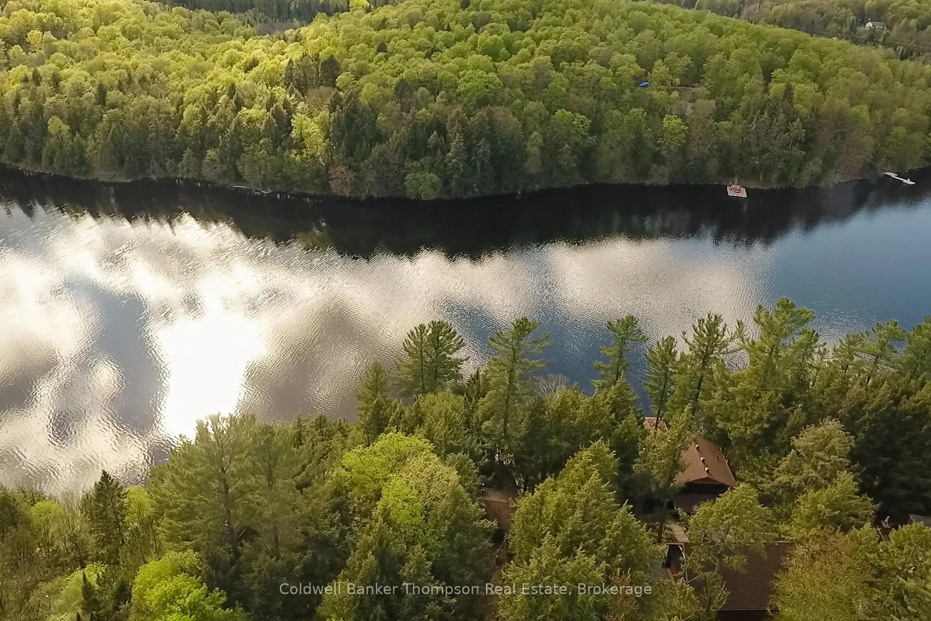 A pic from outside/outdoor area/front of a property/back of a property/a pic from drone, water/lake/river/ocean view for 154 North Dr, Huntsville Ontario P1H 2J2