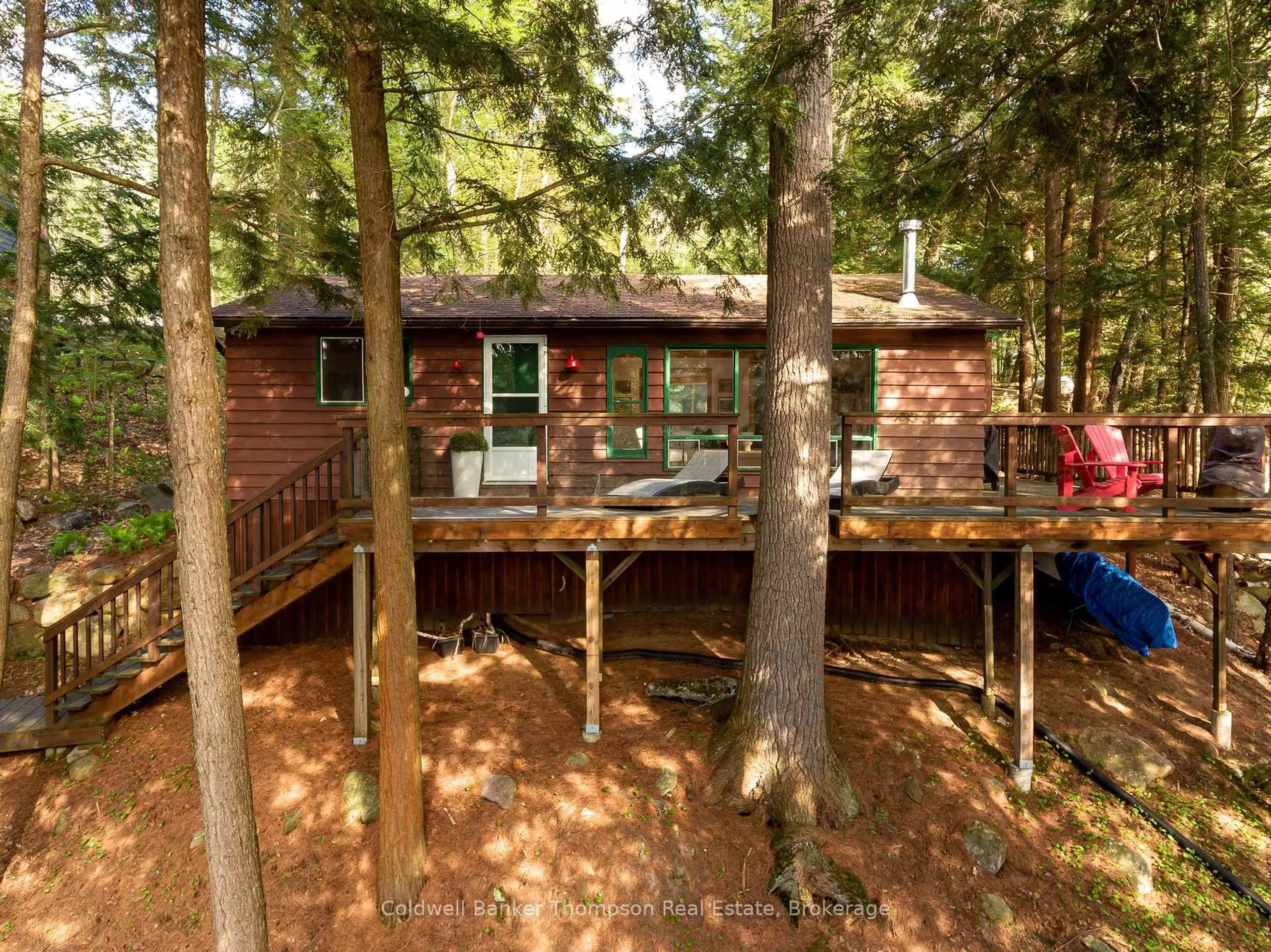 A pic from outside/outdoor area/front of a property/back of a property/a pic from drone, forest/trees view for 154 North Dr, Huntsville Ontario P1H 2J2