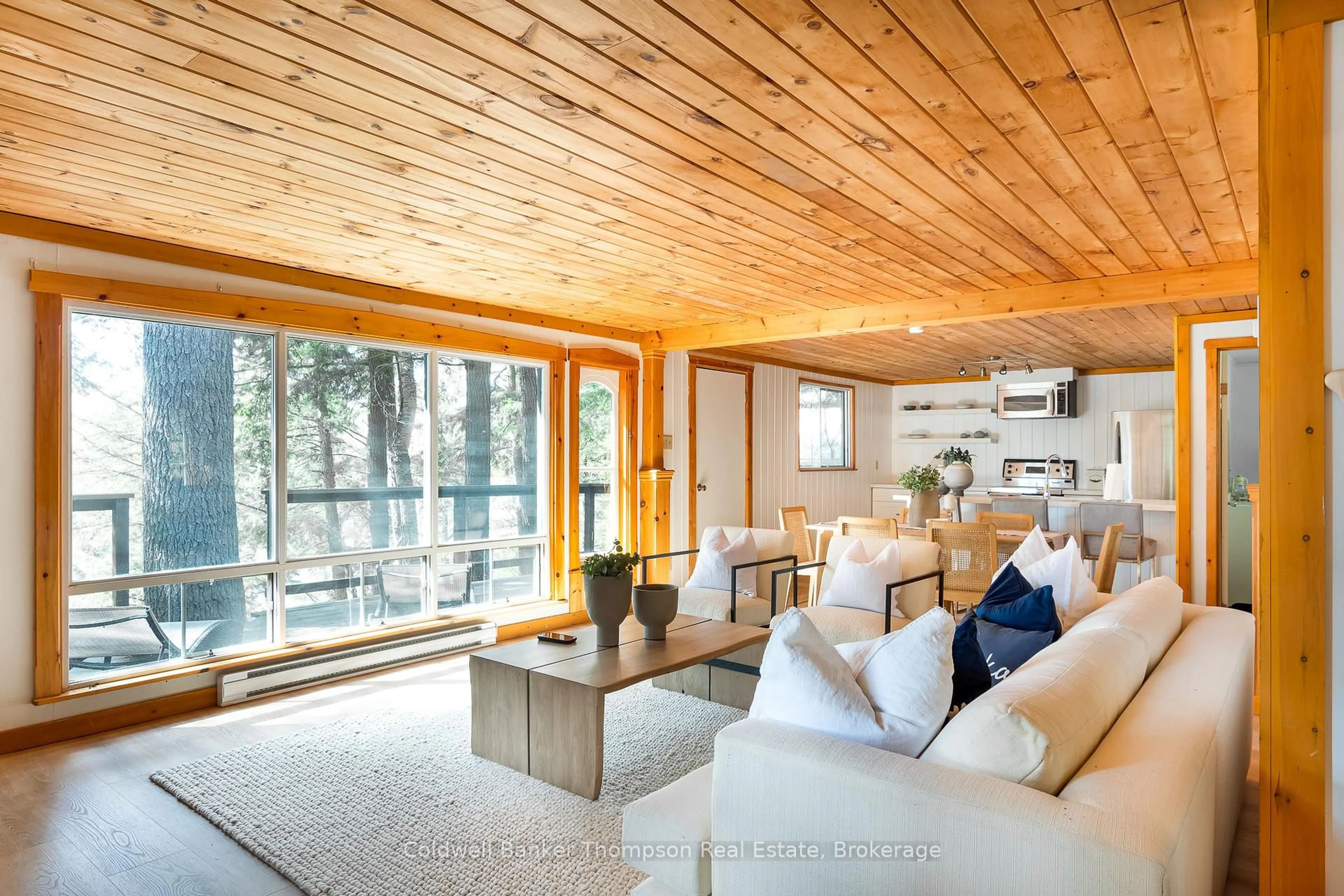 Living room with furniture, wood/laminate floor for 154 North Dr, Huntsville Ontario P1H 2J2