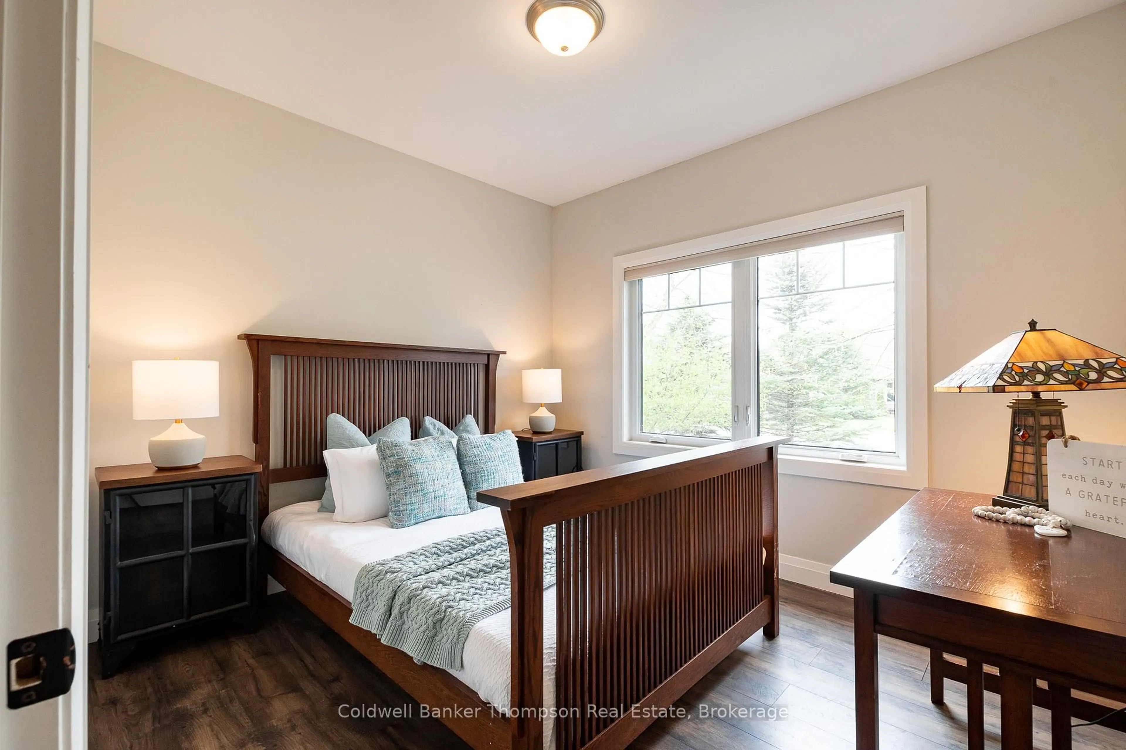 Bedroom with bed, wood/laminate floor for 39 Goodwin Dr, Huntsville Ontario P1H 2R3