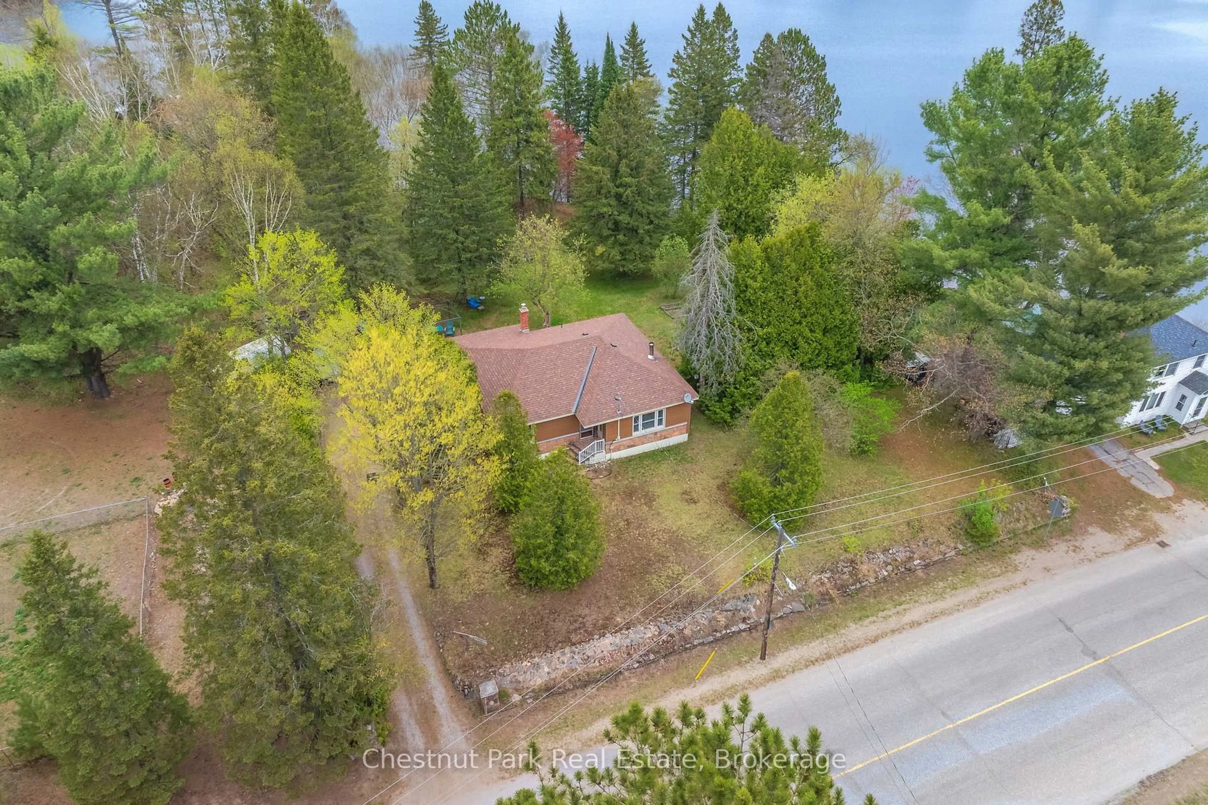 A pic from outside/outdoor area/front of a property/back of a property/a pic from drone, water/lake/river/ocean view for 24 Main St, Kearney Ontario P0A 1M0