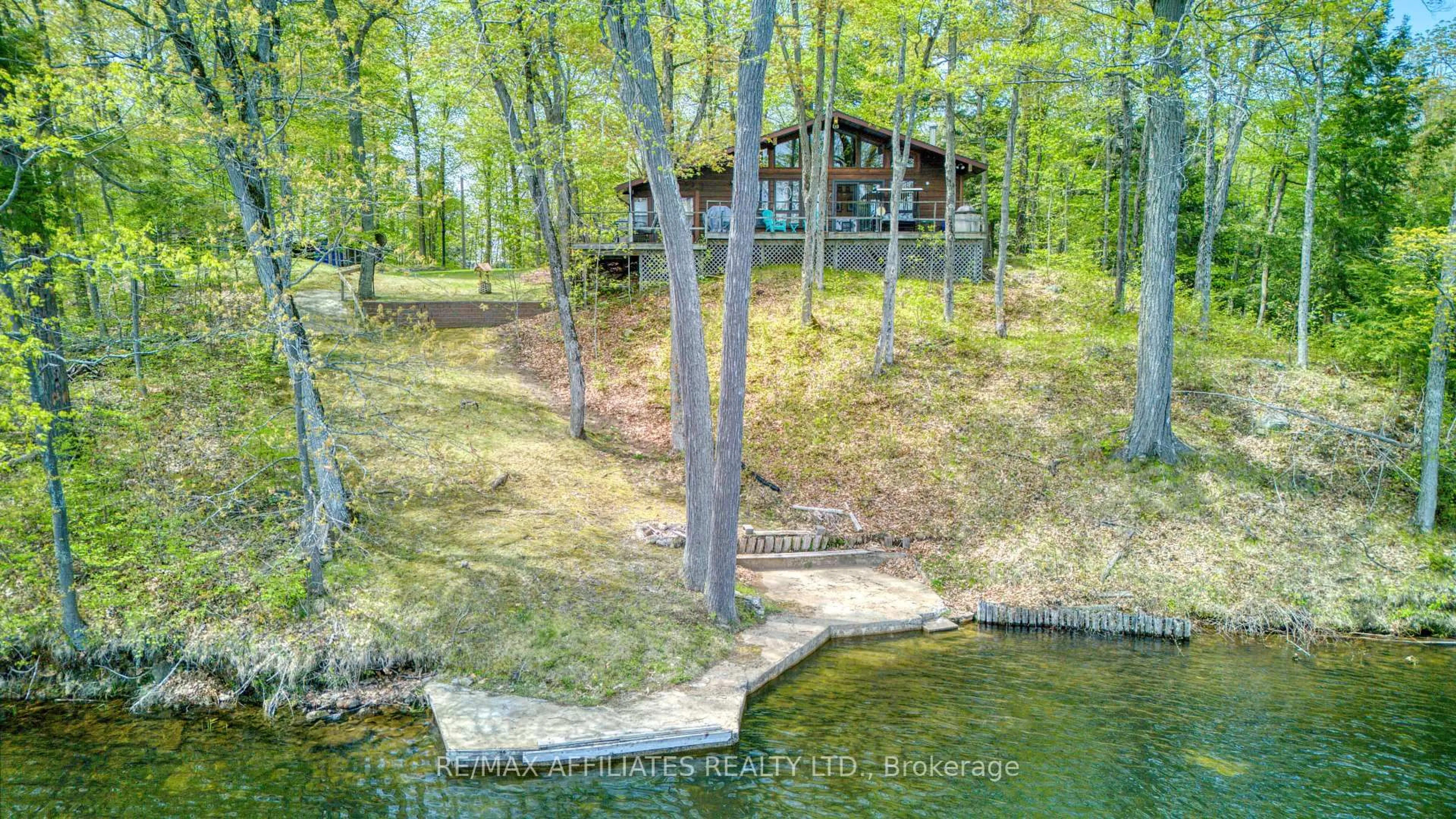 A pic from outside/outdoor area/front of a property/back of a property/a pic from drone, water/lake/river/ocean view for 787 Sherbrooke Dr, Maberly Ontario K0H 2B0