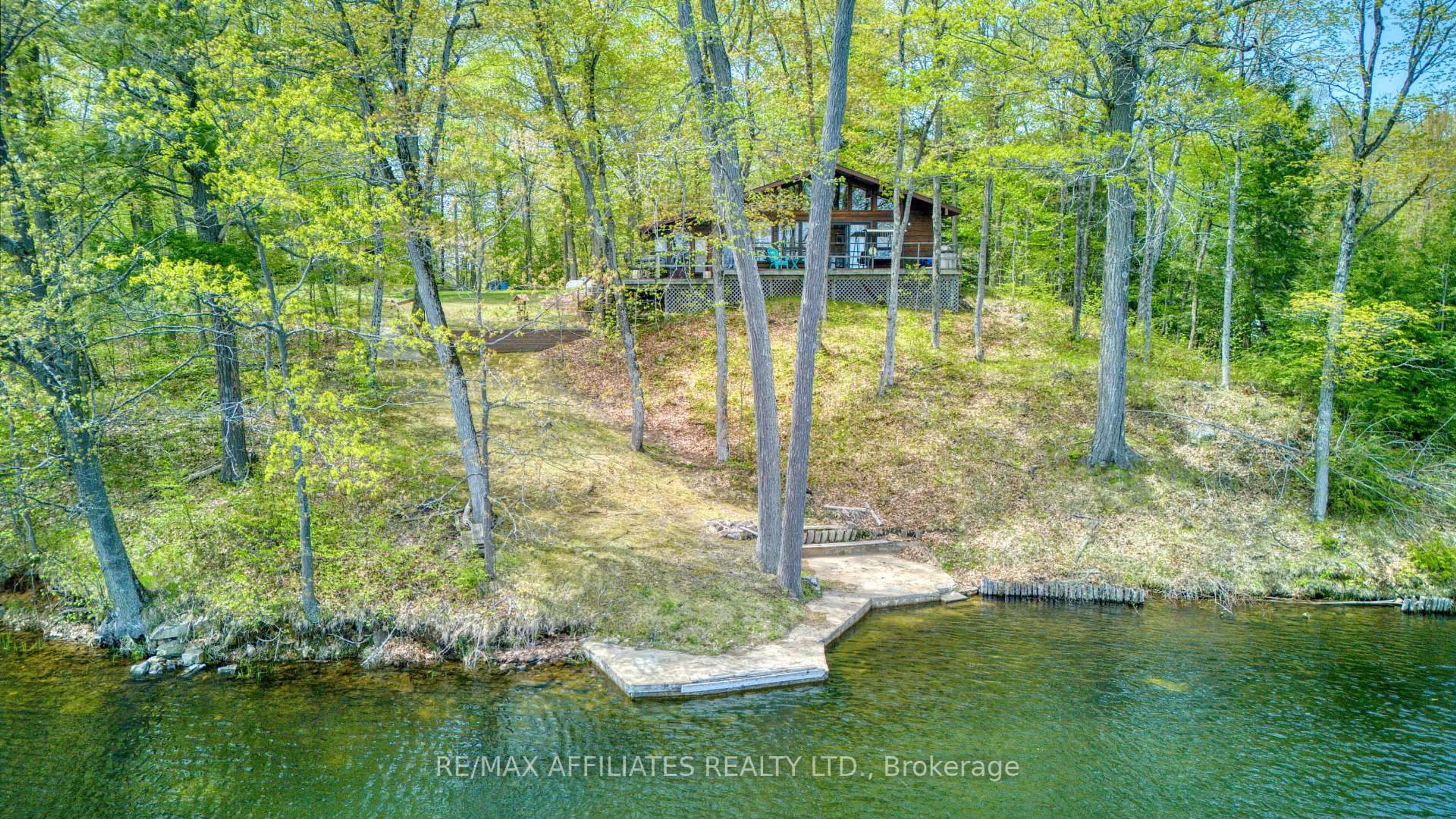 A pic from outside/outdoor area/front of a property/back of a property/a pic from drone, water/lake/river/ocean view for 787 Sherbrooke Dr, Maberly Ontario K0H 2B0